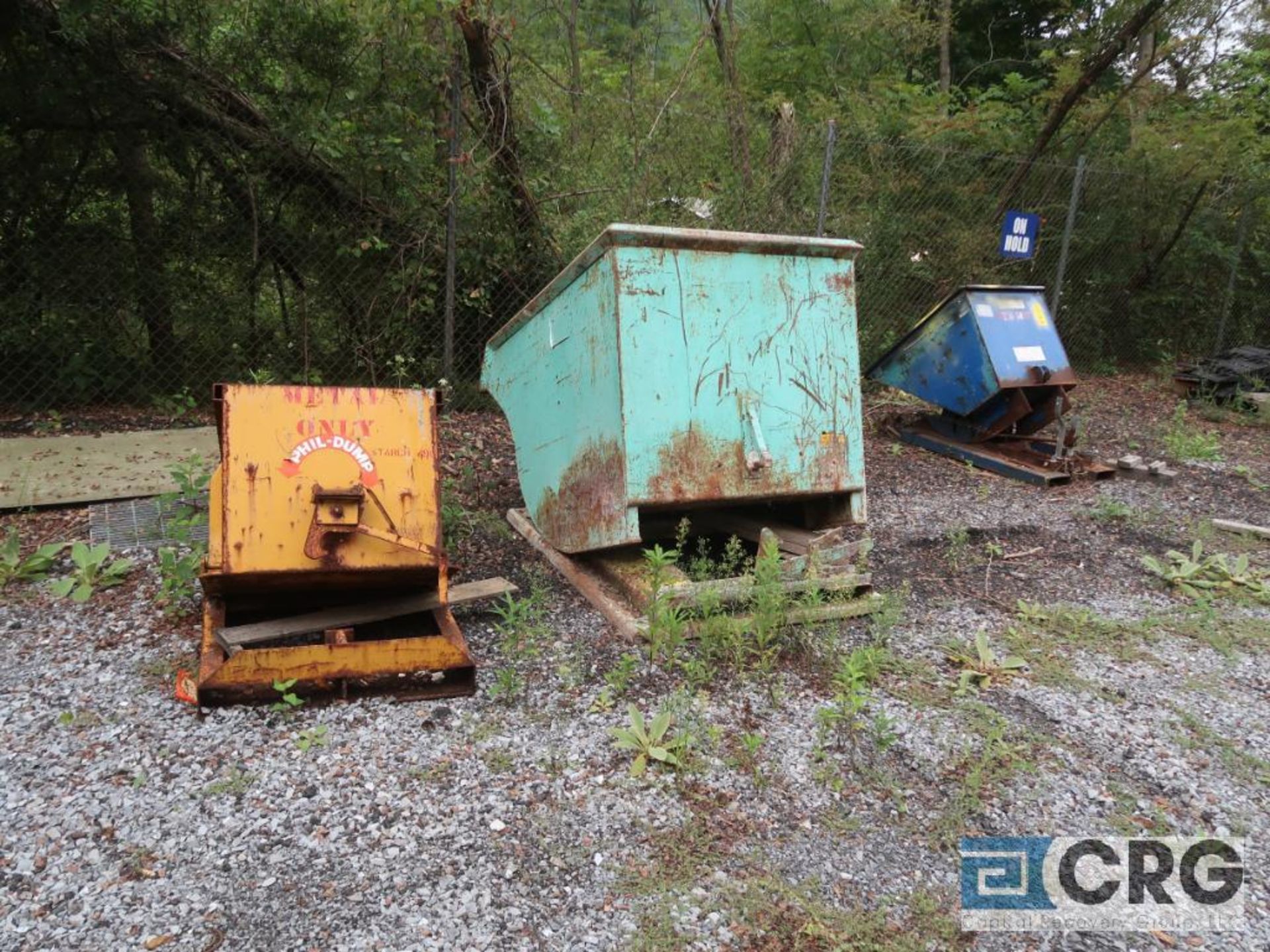 Lot of miscellaneous items including self dumping hoppers, grating, steel pipe on ground, cement