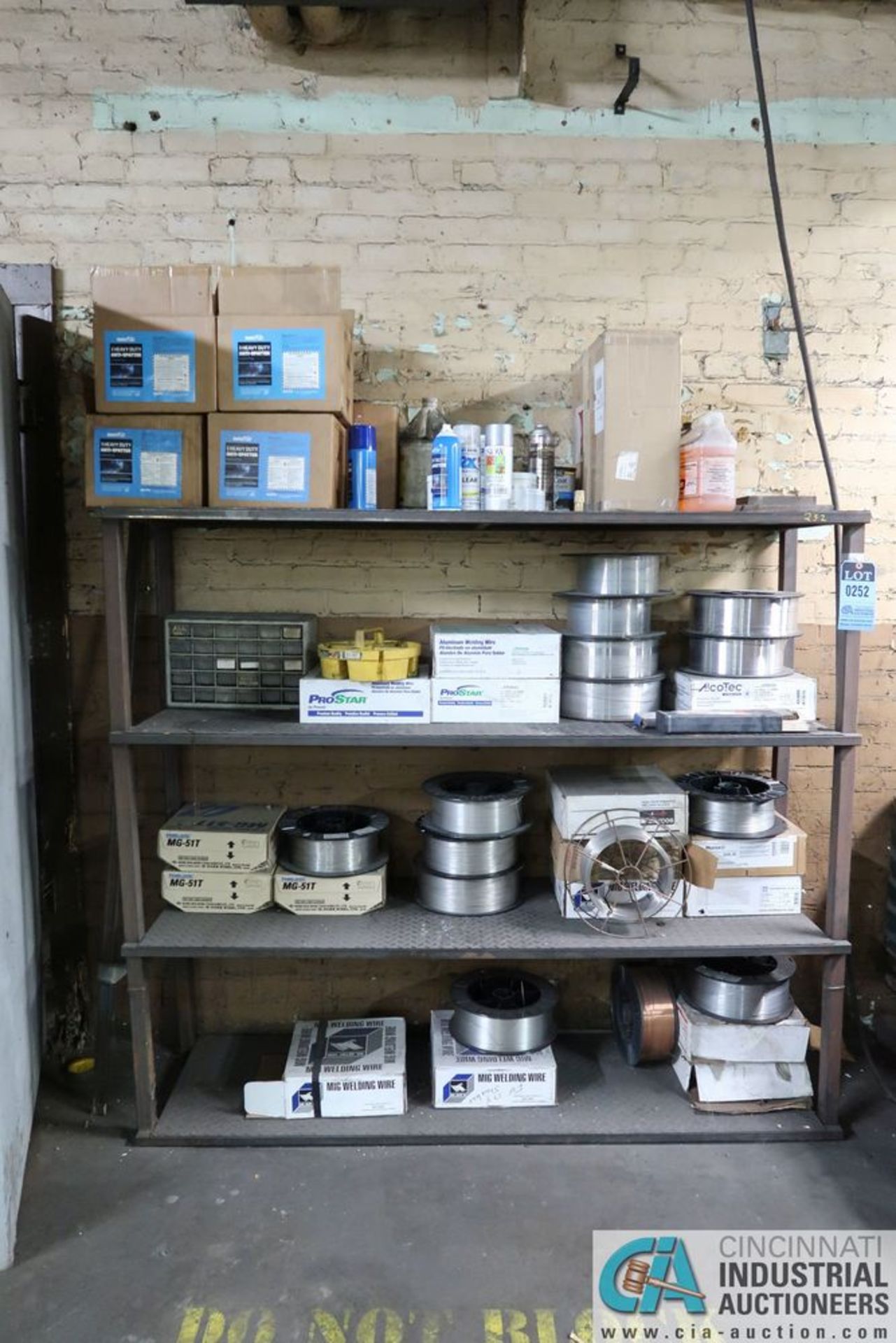 (LOT) MISCELLANEOUS WELDING WIRE AND ANTI-SPATTER WITH STEEL RACK