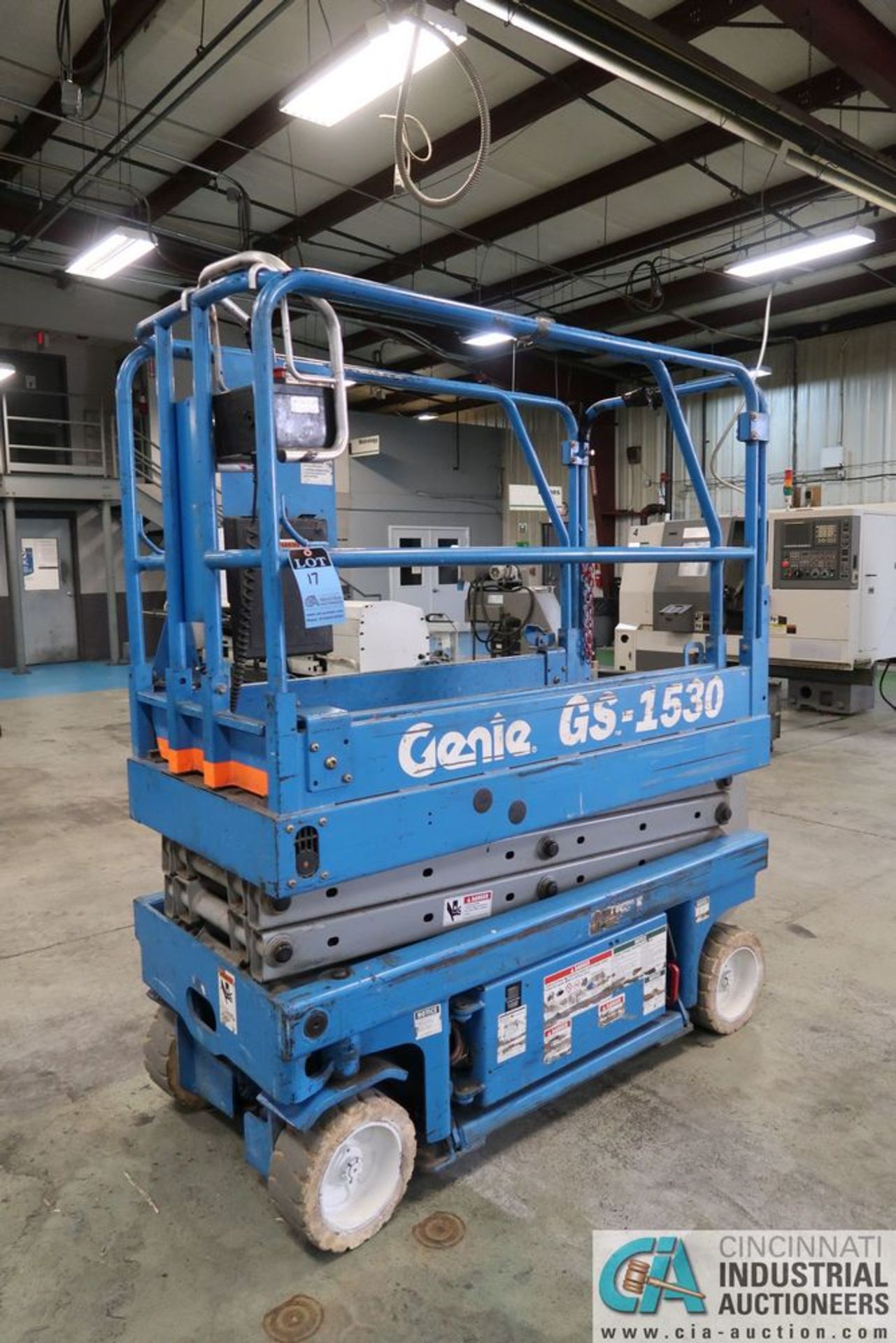 GENIE MODLE GS-1530 ELECTRIC SCISSOR LIFT; S/N 24168, 15' MAX HEIGHT, 500 LB. MAX WEIGHT, 64" - 101"