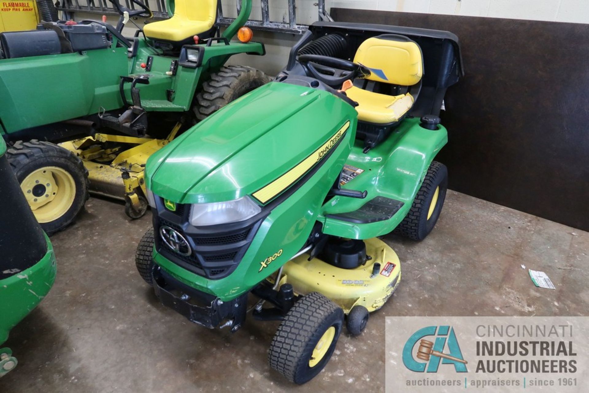 JOHN DEERE X300 GAS POWERED TRACTOR, KAWASAKI ENGINE, 42" MOWER, BAGGER, 634 HOURS