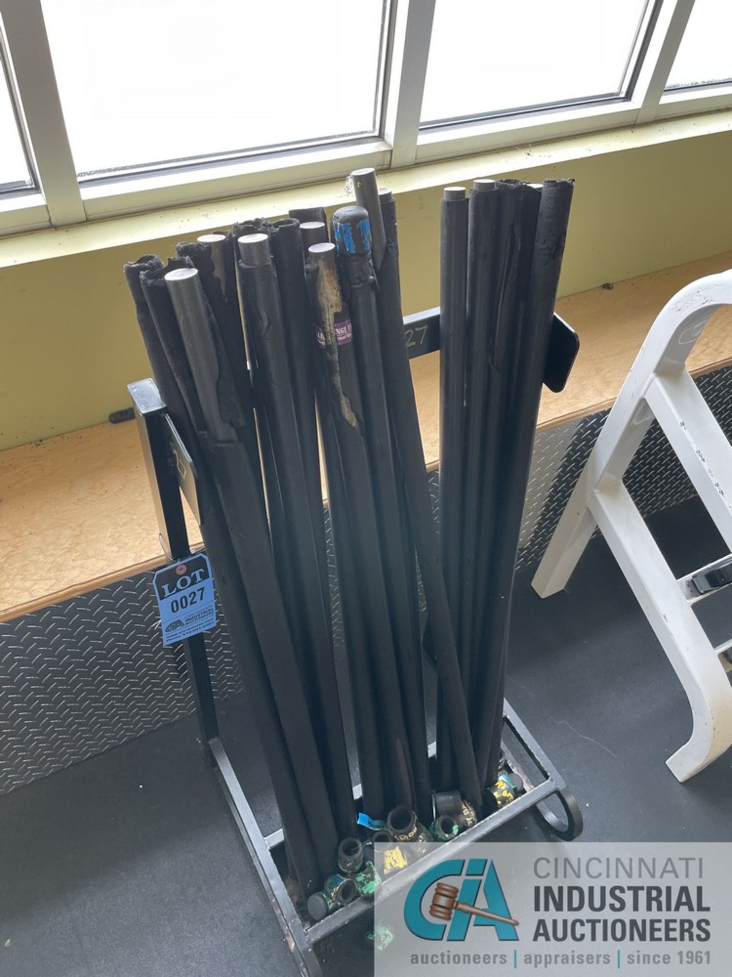 RACK WITH MISCELLANEOUS WEIGHTED CHALLENGE BARS **ATTN: This lot is located on the second floor. - Image 2 of 7