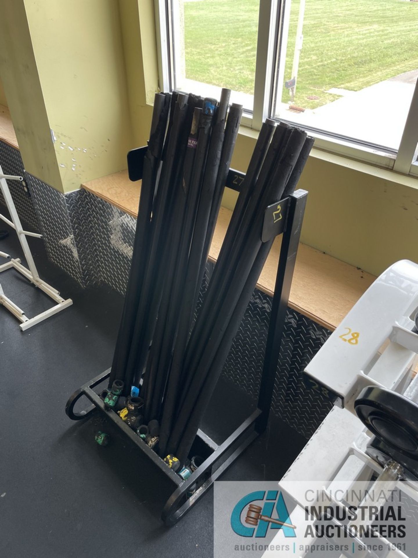 RACK WITH MISCELLANEOUS WEIGHTED CHALLENGE BARS **ATTN: This lot is located on the second floor. - Image 3 of 7