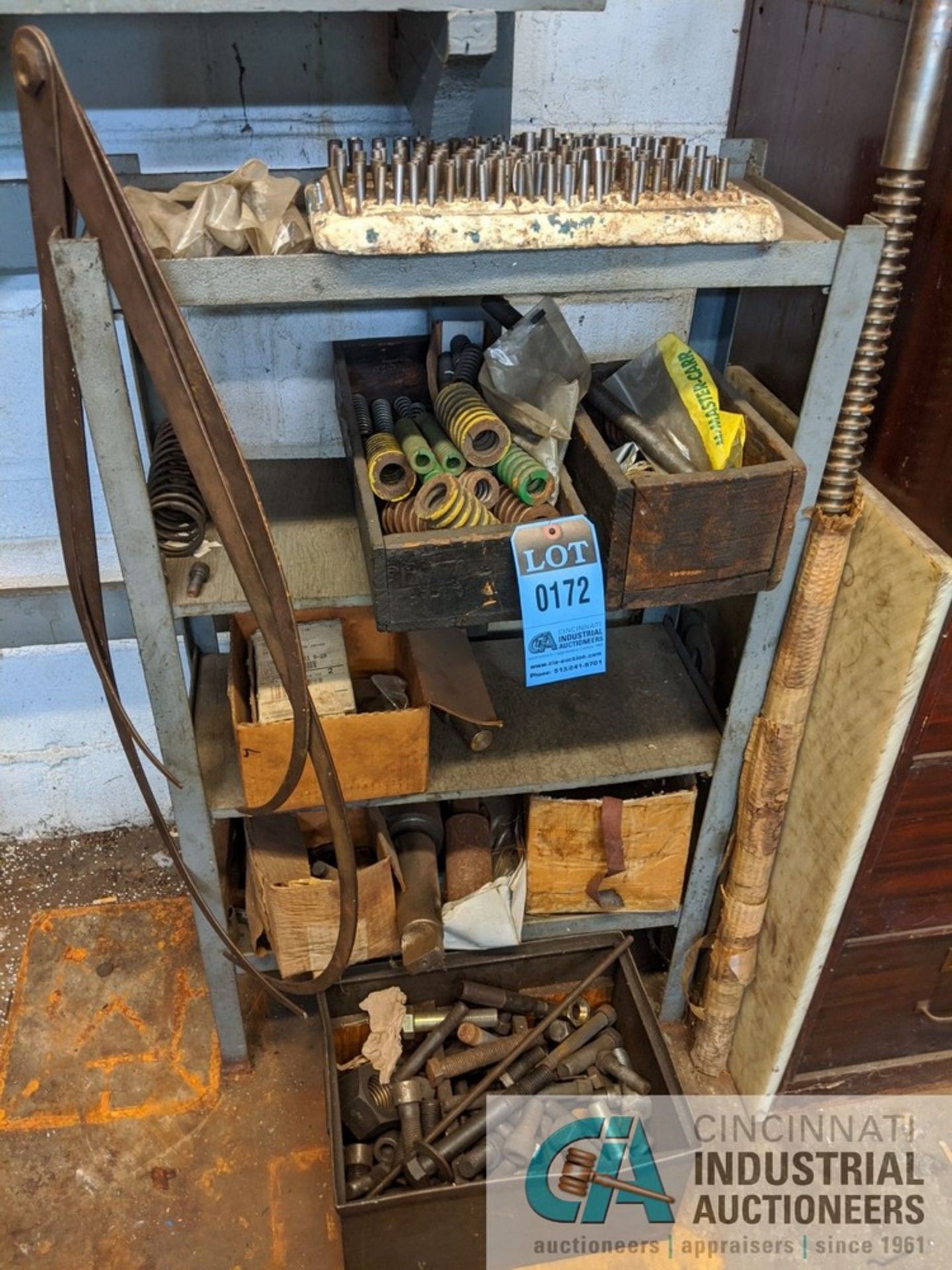 (LOT) RACK WITH SPRINGS, TOOLING, AND HARDWARE ON FLOOR AND MACHINE PARTS ON LOWER WOOD SHELF UNIT