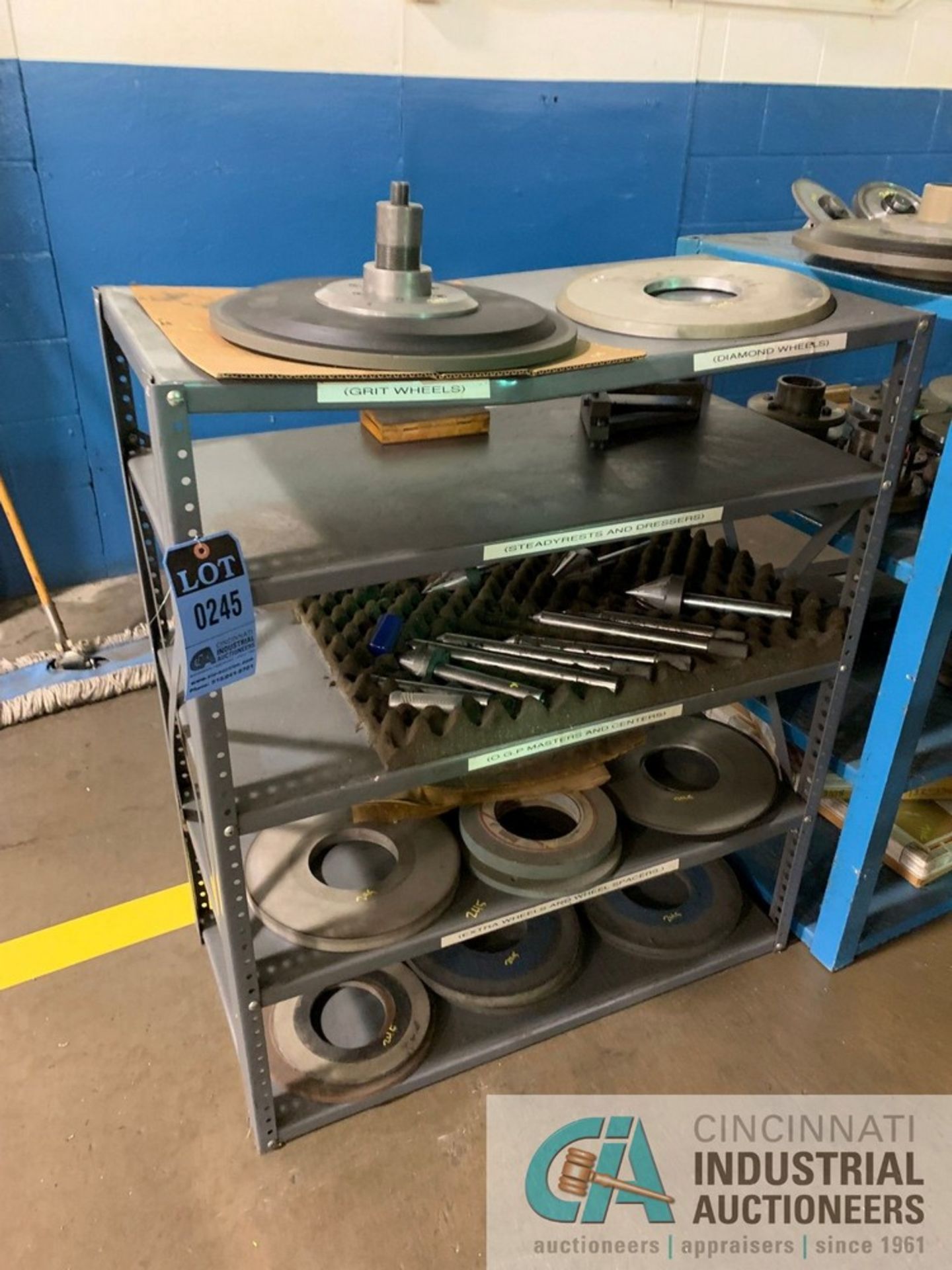 (LOT) (11) GRINDING WHEELS W/ SHELVING UNIT