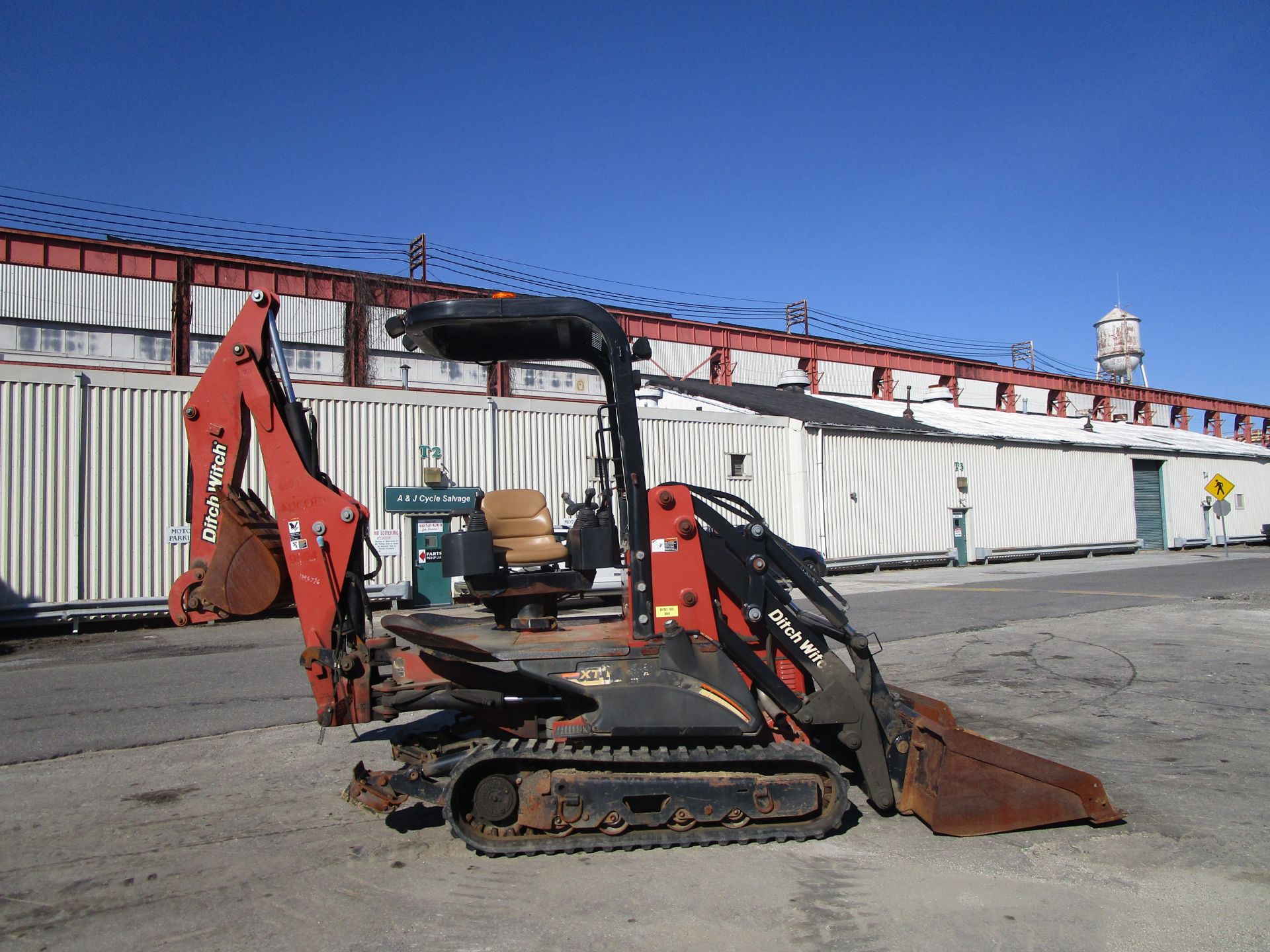 2011 Ditch Witch XT1600 Backhoe with Trailer and Attachments