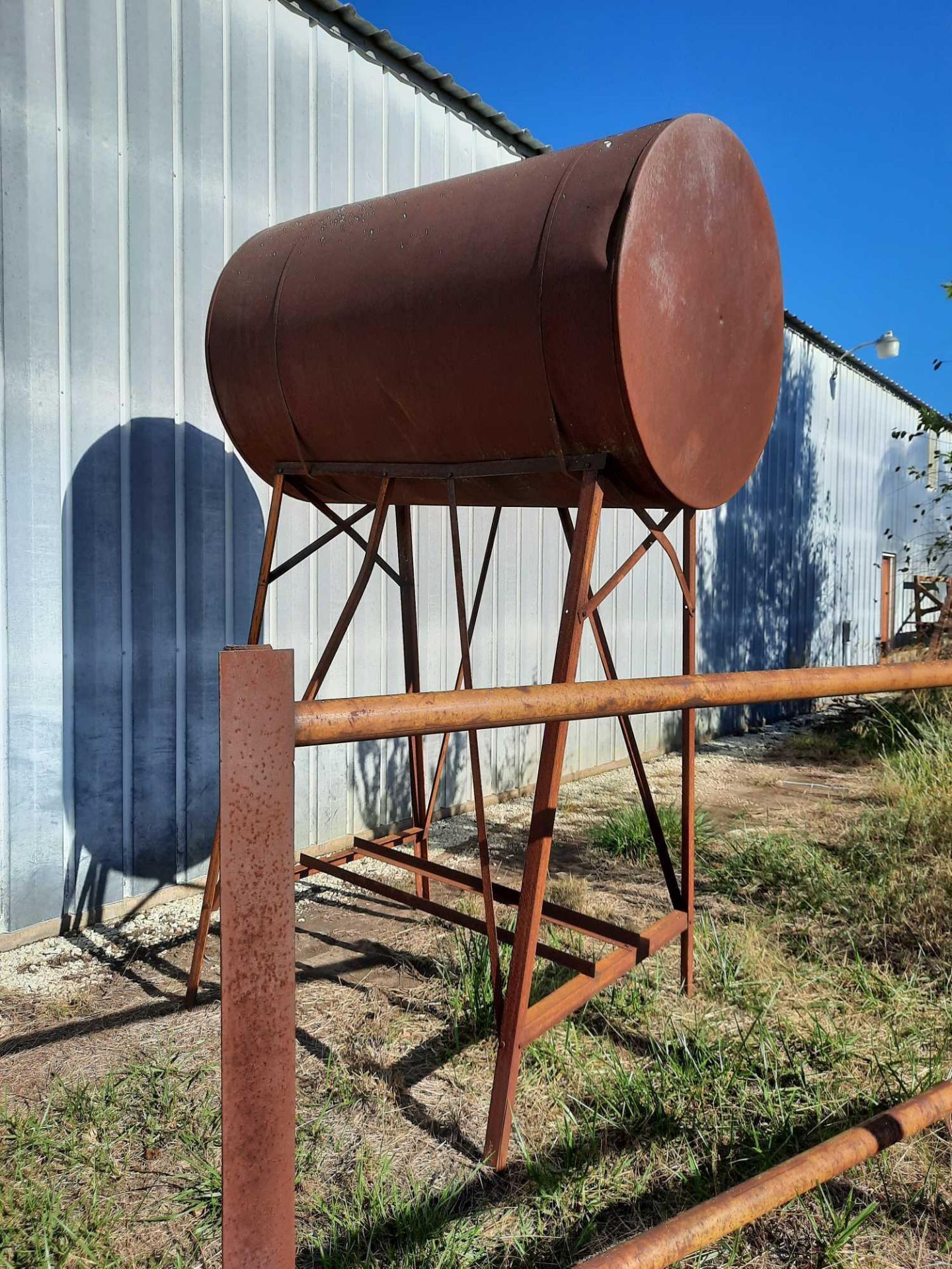 Fuel barrel in stand, barrel 4ft diameter x 6ft length, stand 7ft height (Note: we do not have