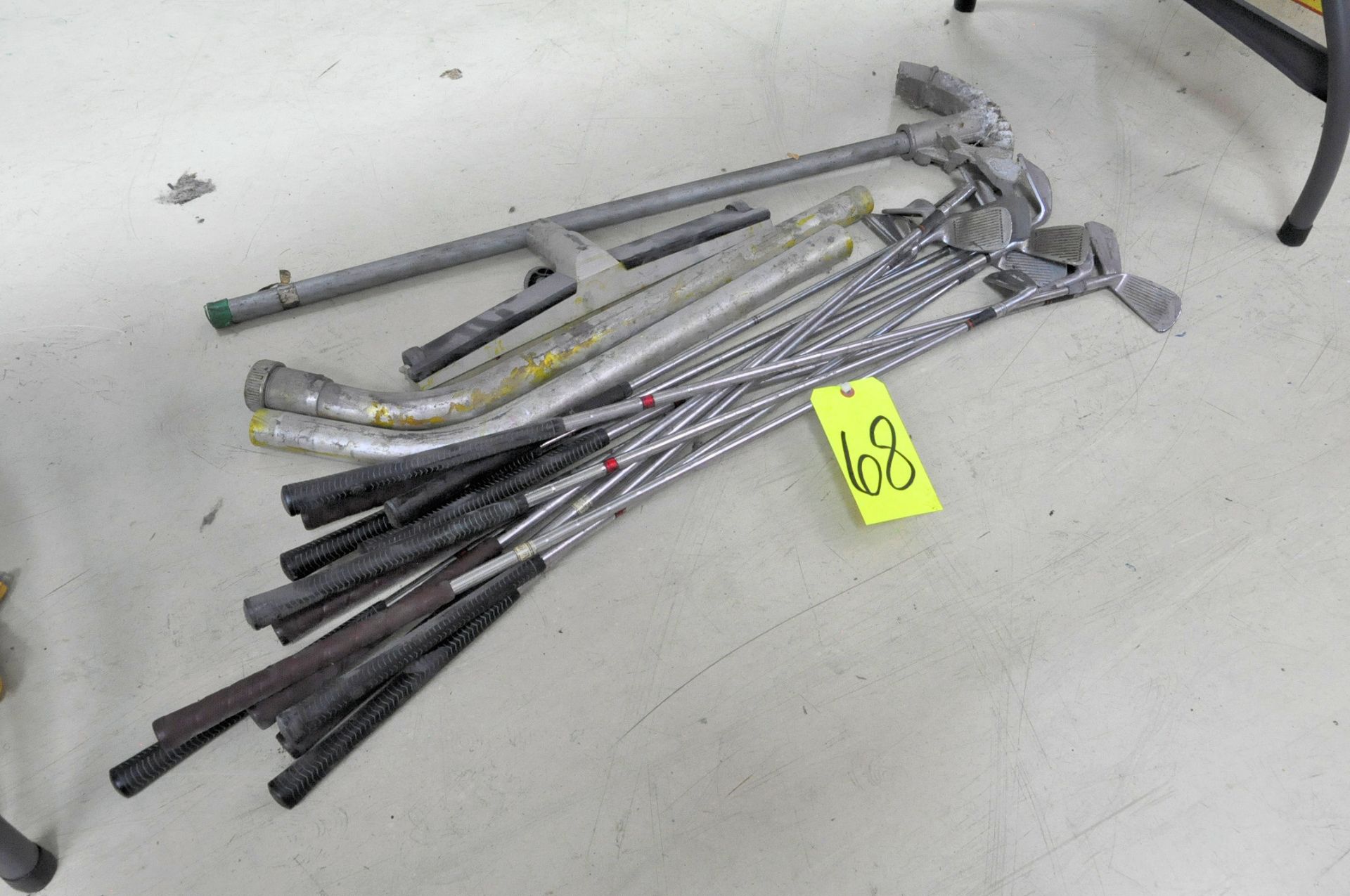 Lot-Golf Clubs, Conduit Bender and Vacuum Attachments Under (1) Table