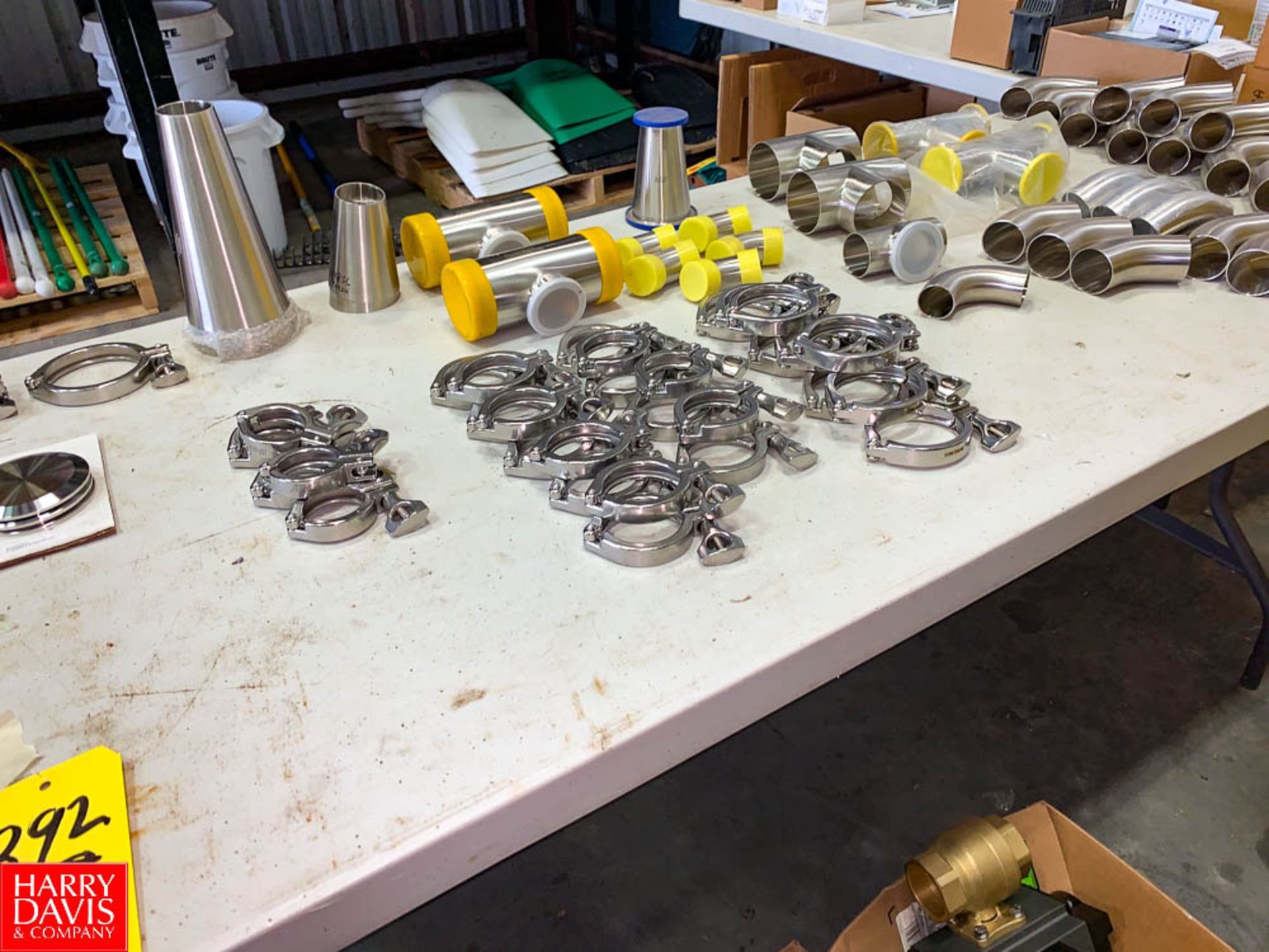 NEW (50+) S/S Clamps, Caps, Reducers, and Tees, Up To 3" **Table Not Included Rigging Fee: $ 50