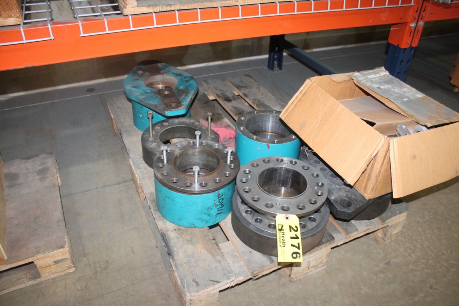 ASSORTED STEEL COUPLINGS ON PALLET AND PART ON ABOVE SHELF