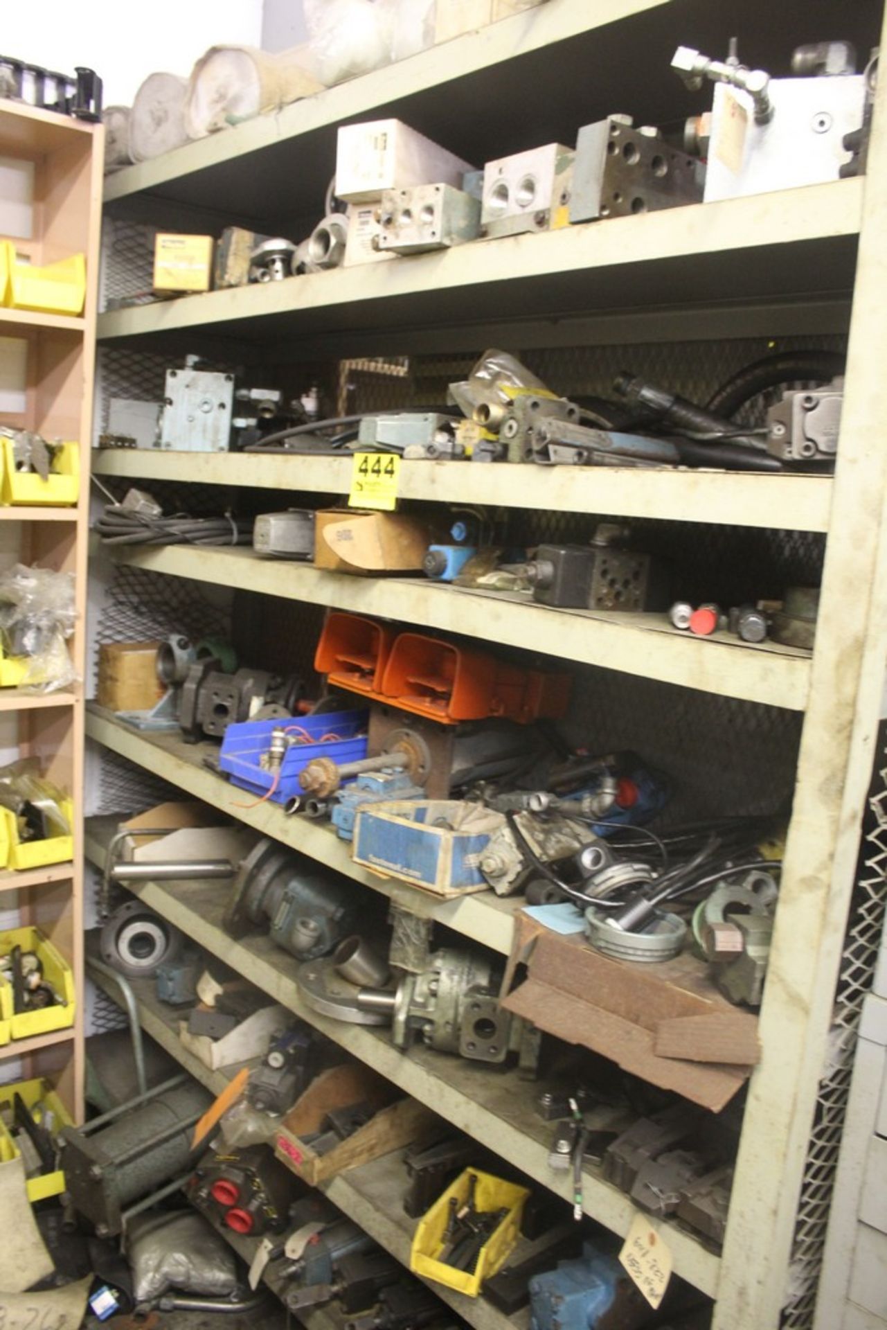 SHELVING UNIT WITH CONTENTS: HYDRAULIC MOTORS, FILTERS, ETC.