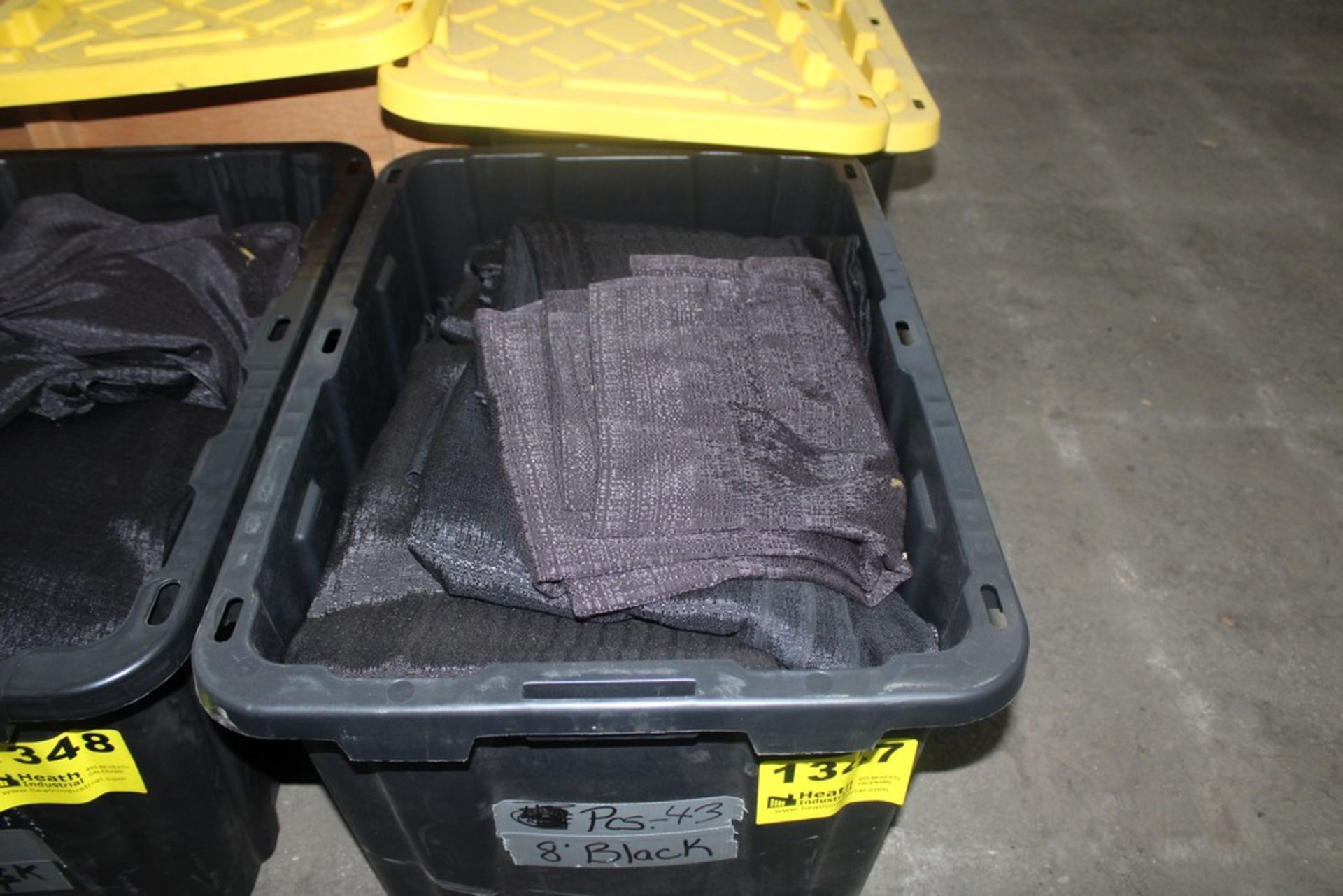 APPROX. (43) 8FT BLACK DRAPES IN TOTE ( QUANTITES NOT GUARANTEED)
