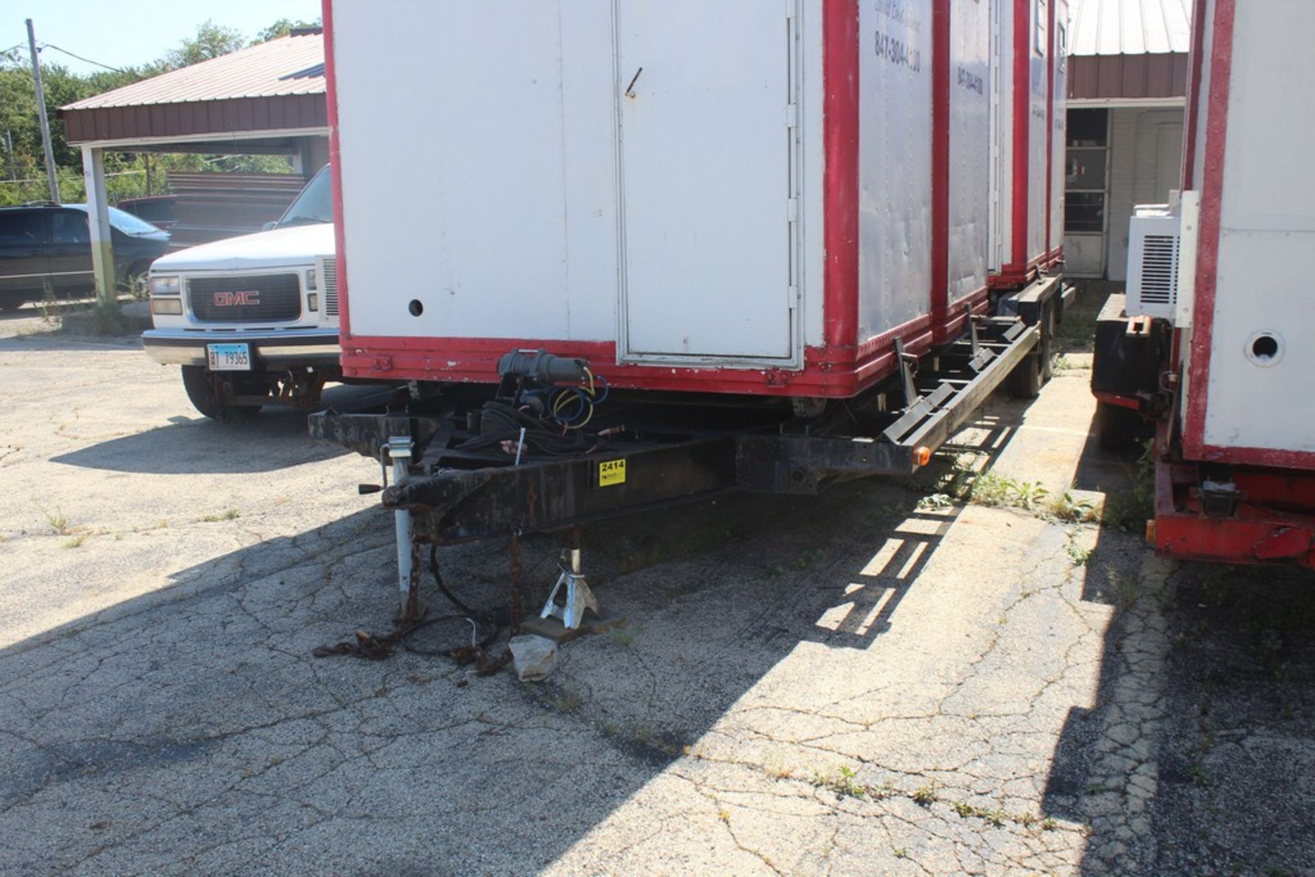 TANDEM AXLE FLATBED TRAILER, 24' WITH (4) TICKET BOOTHS, 7' X 56" X 93" WITH A/C UNITS