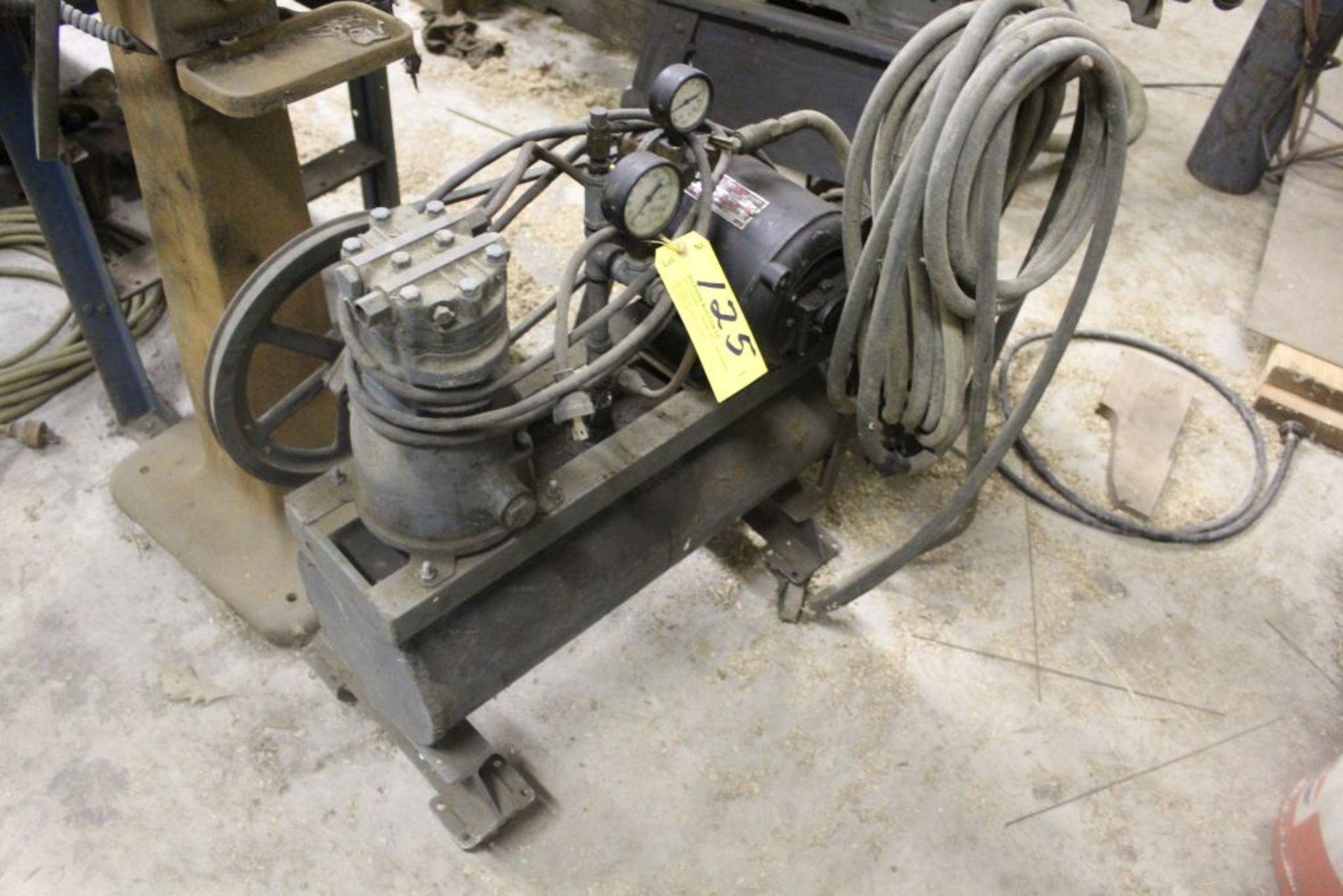 Air compressor, 1/2 HP single cyl., on casters w/hose.
