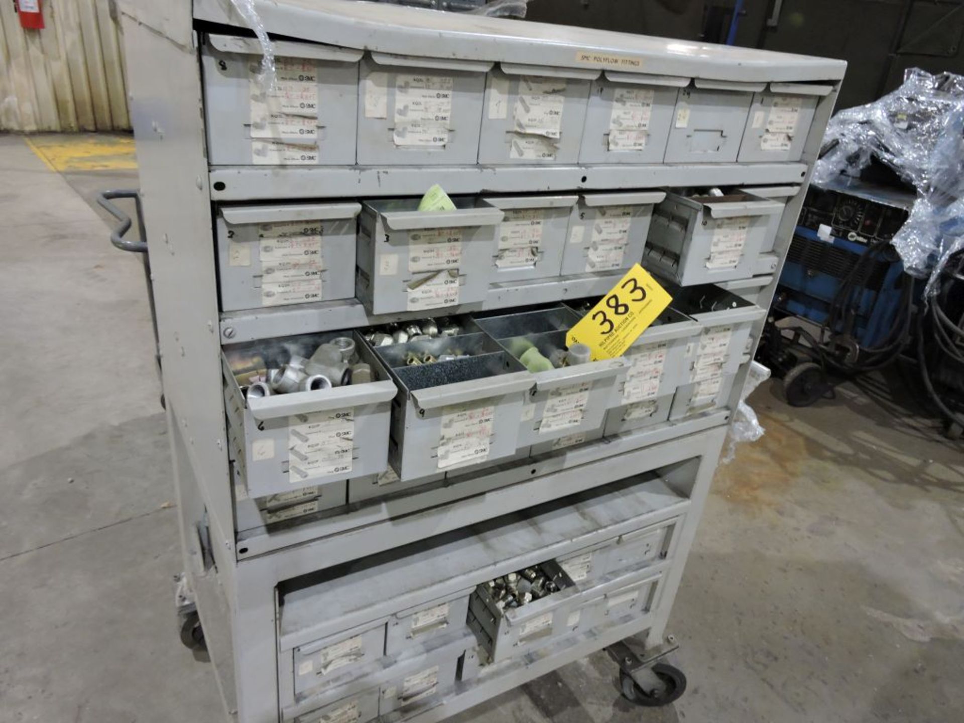 Polyflow connectors 72 drawer, containing brass, etc., on rolling cart.