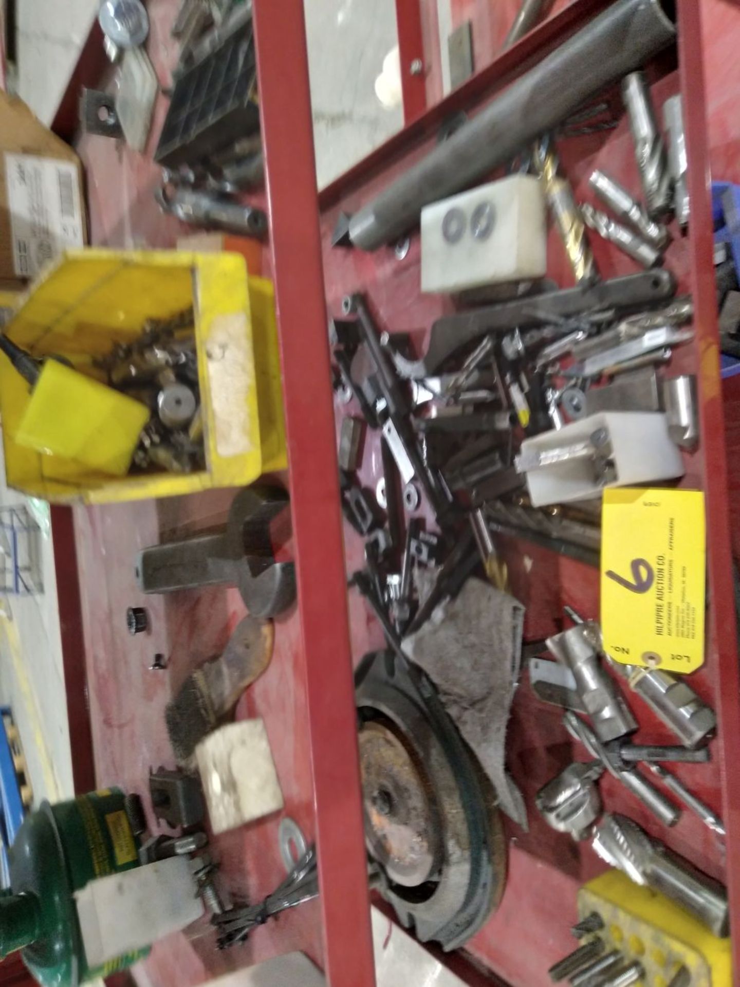 Assorted items on 3 shelves, reamers & bits.