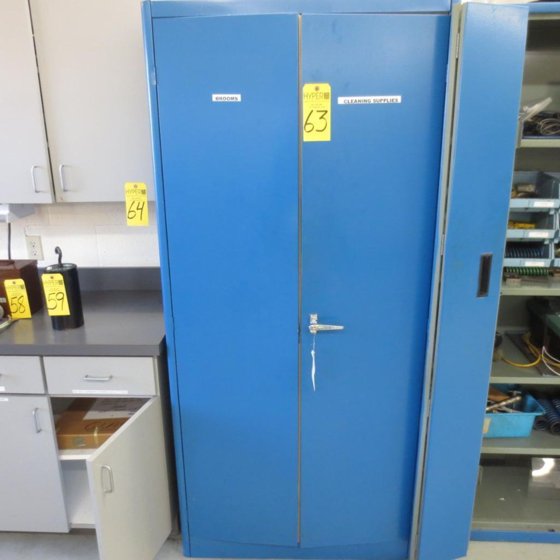 Two Door Cabinet with Brooms, Pump and Buckets