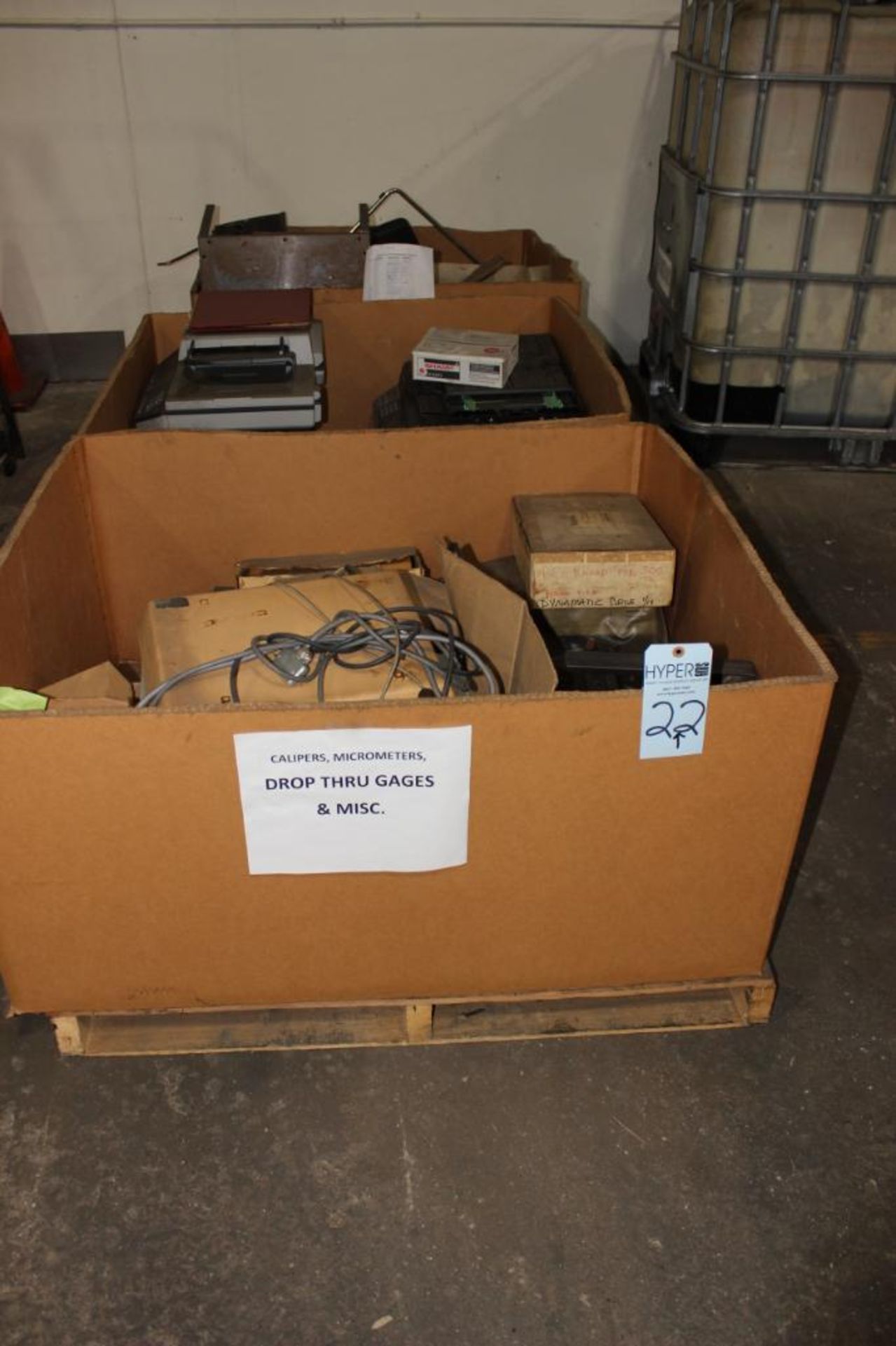 Lot c/o: Row of boxes including copiers & Misc. equipment & tank ( has hole in it)
