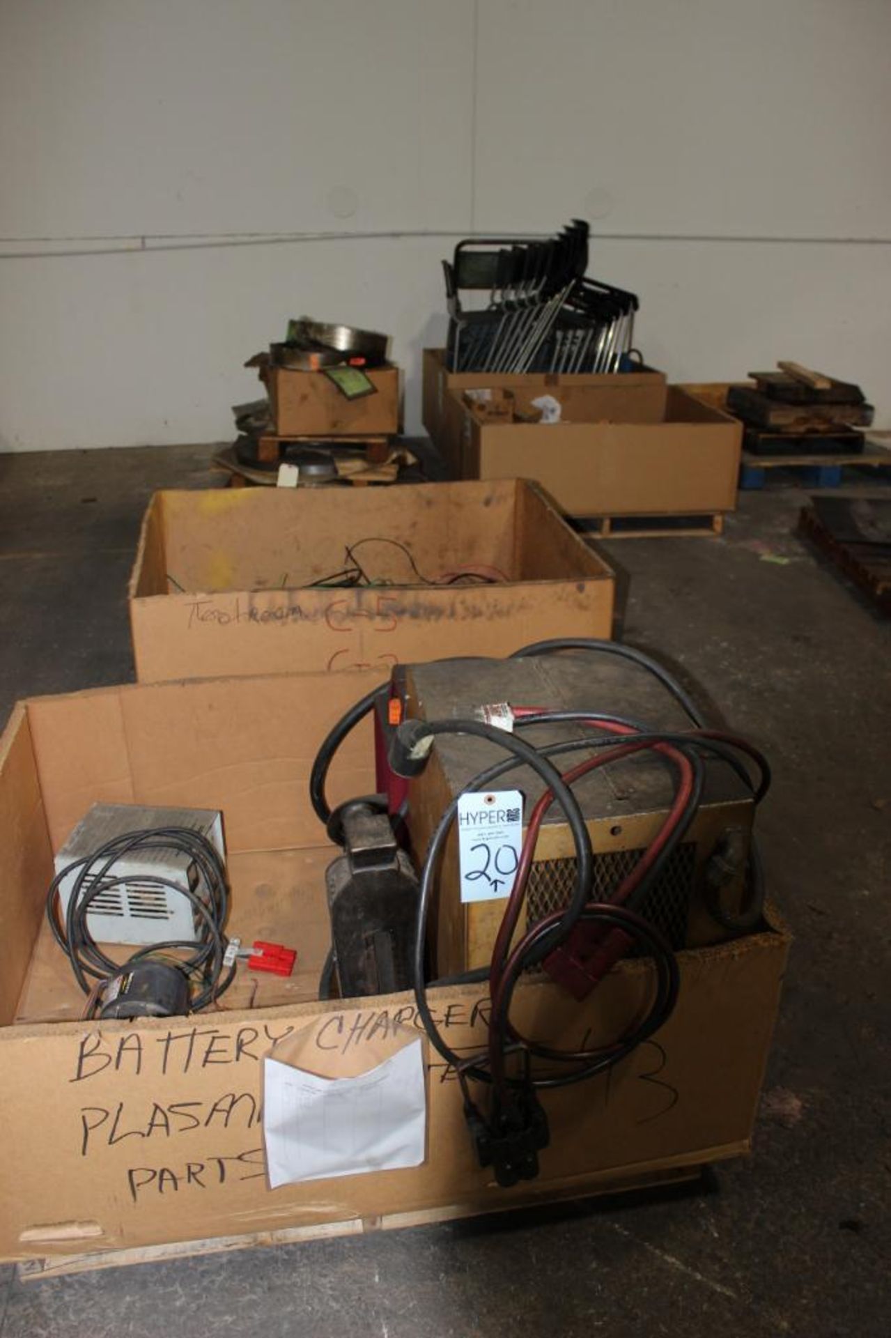 Lot c/o: Row of boxes includes chargers, wire, roll stock & chairs