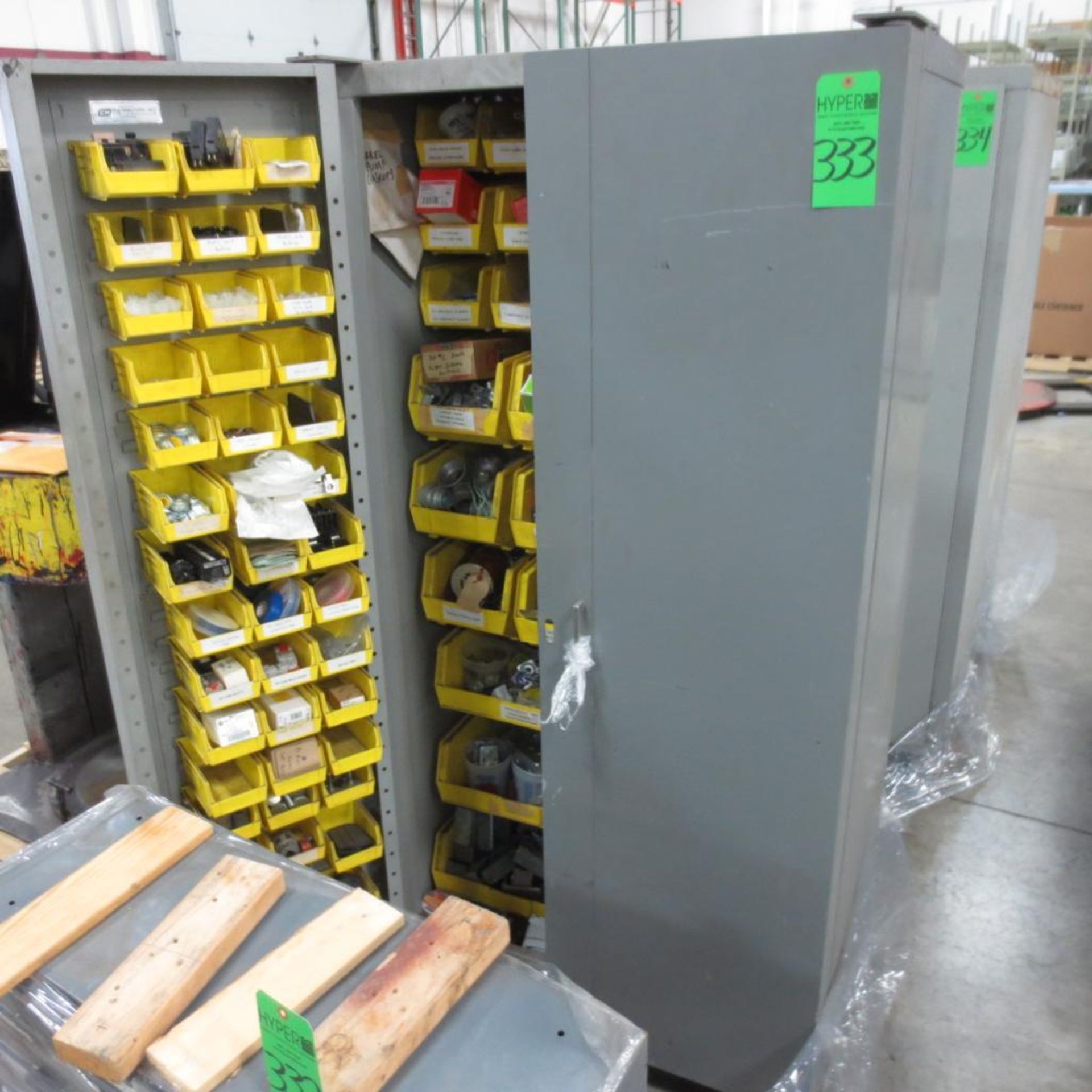 Two Door Storage Cabinet With Electrical Parts.**Lot Located at 2395 Dakota Drive, Grafton, WI 53024
