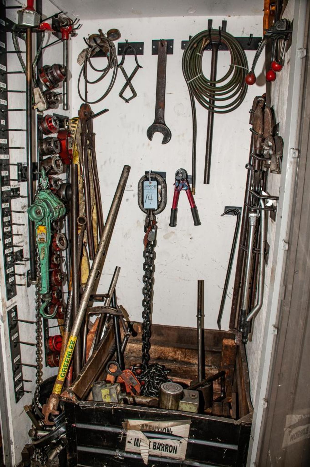 Contents of Right-Hand side of Tool Locker. Manual Pipe Threaders and Dies, Rigging Chains, Strap, M