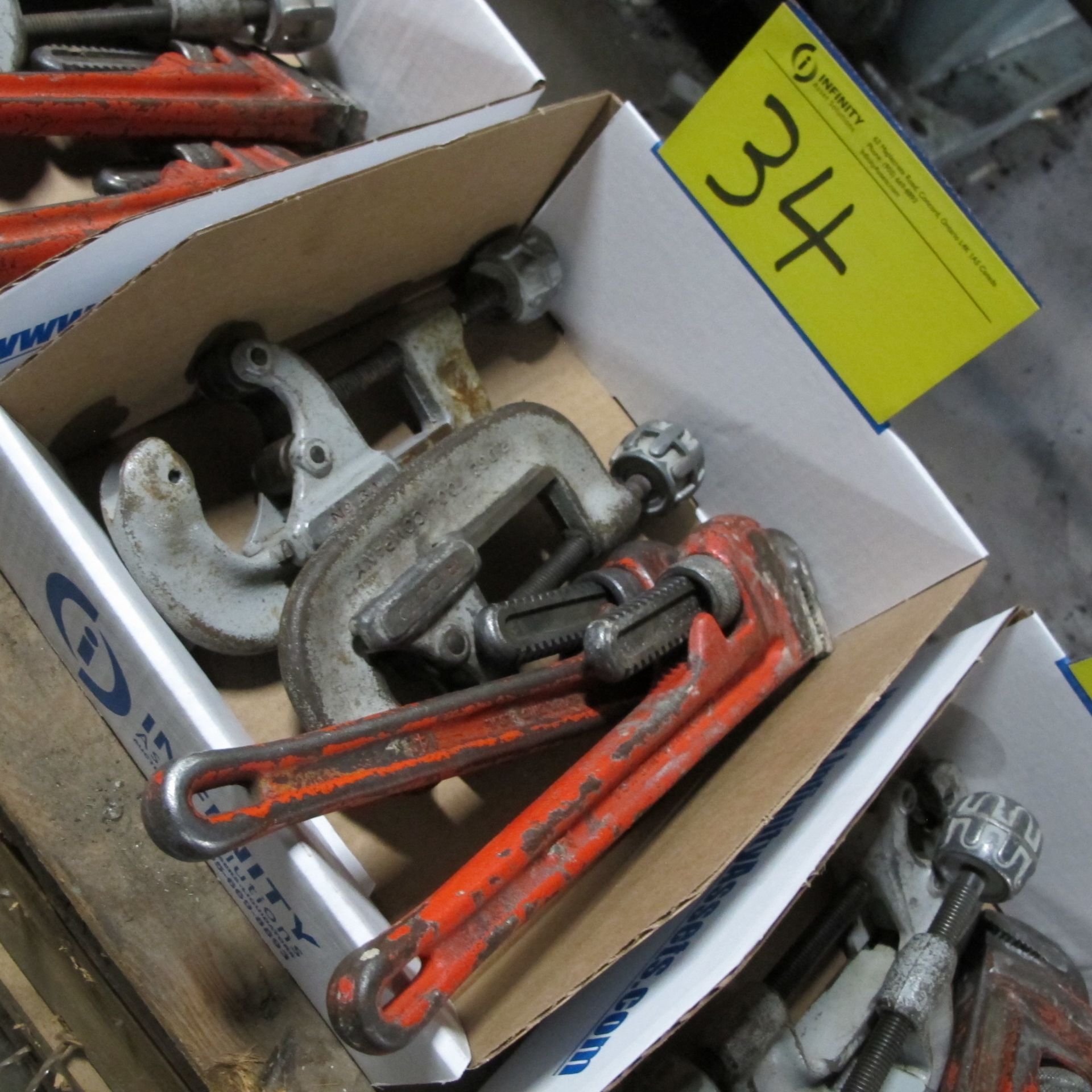 LOT OF (1) BOX W/ (2) RIDGID PIPE CUTTERS 1-3", (2) RIDGID PIPE WRENCHES 14"