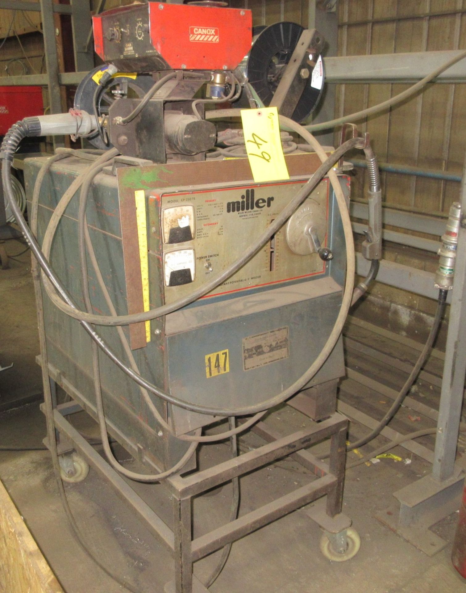 MILLER CP-250TS WELDER W/ CANOX C354E WIRE FEEDER, CART AND CABLES