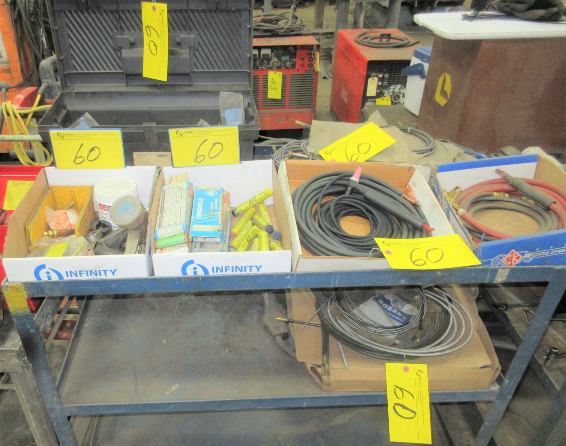 LOT OF WELDING SUPPLIES ON CART INCLUDING TUNCOWELD ELECTRODES, CABLES, TIPS, PARTS, ETC.
