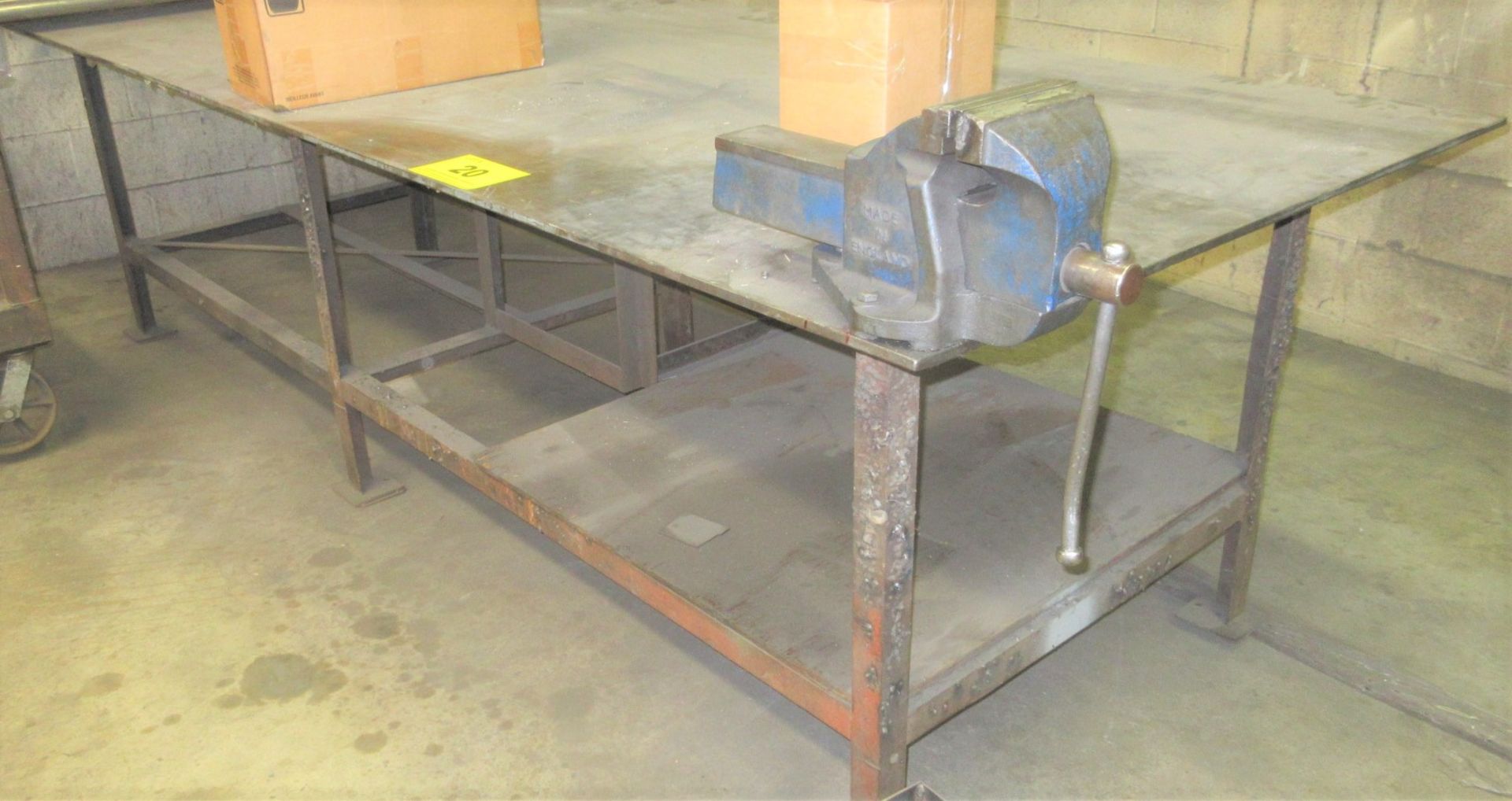 APPROX. 10'L X 4'W X 1/2" THICK TOP WELDING TABLE W/ 6" VISE (NO CONTENTS)