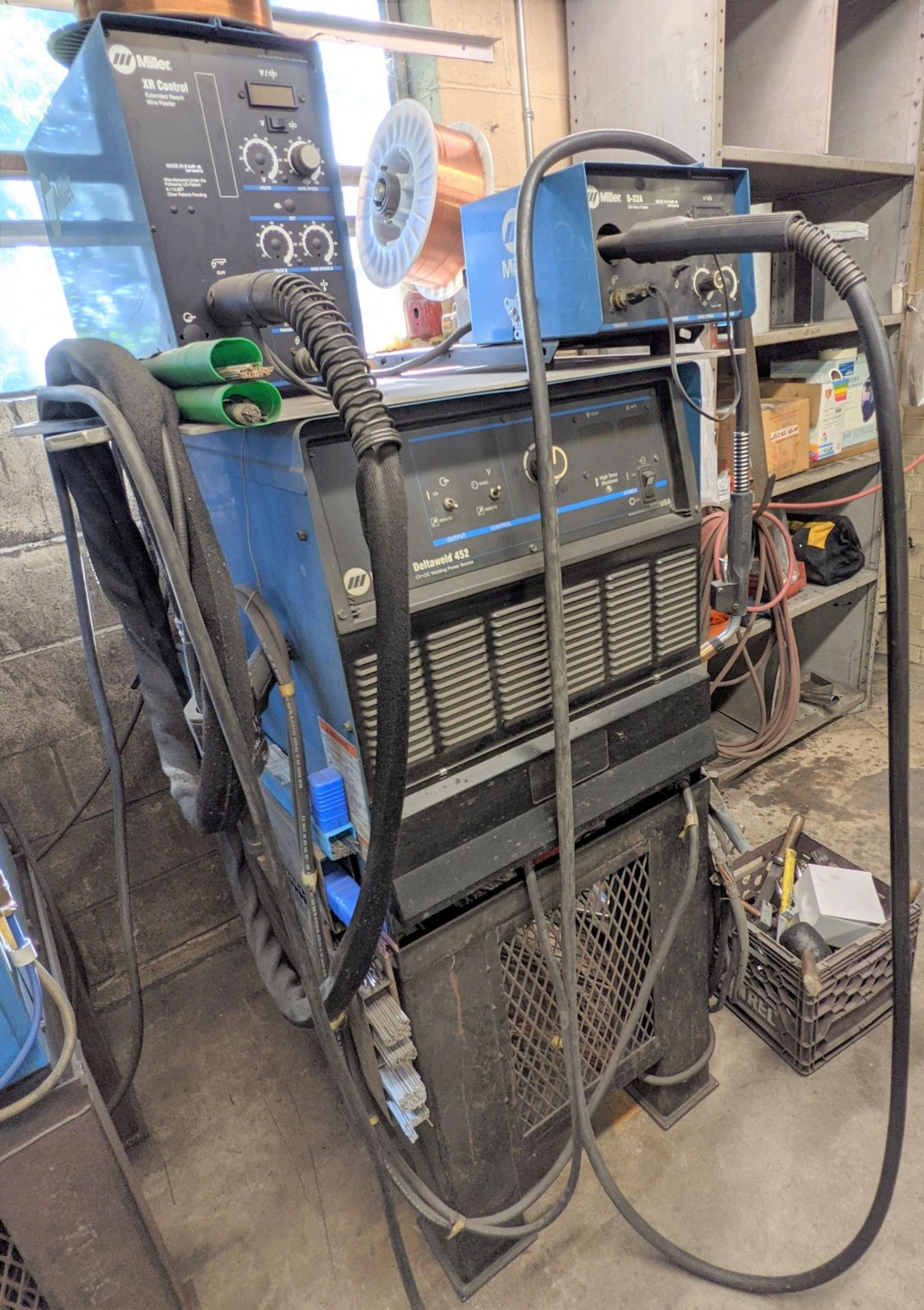 MILLER DELTAWELD 452 MIG WELDER W/ S-22A WIRE FEEDER, CABLES, STAND AND MILLER XR CONTROL W/ XR15A