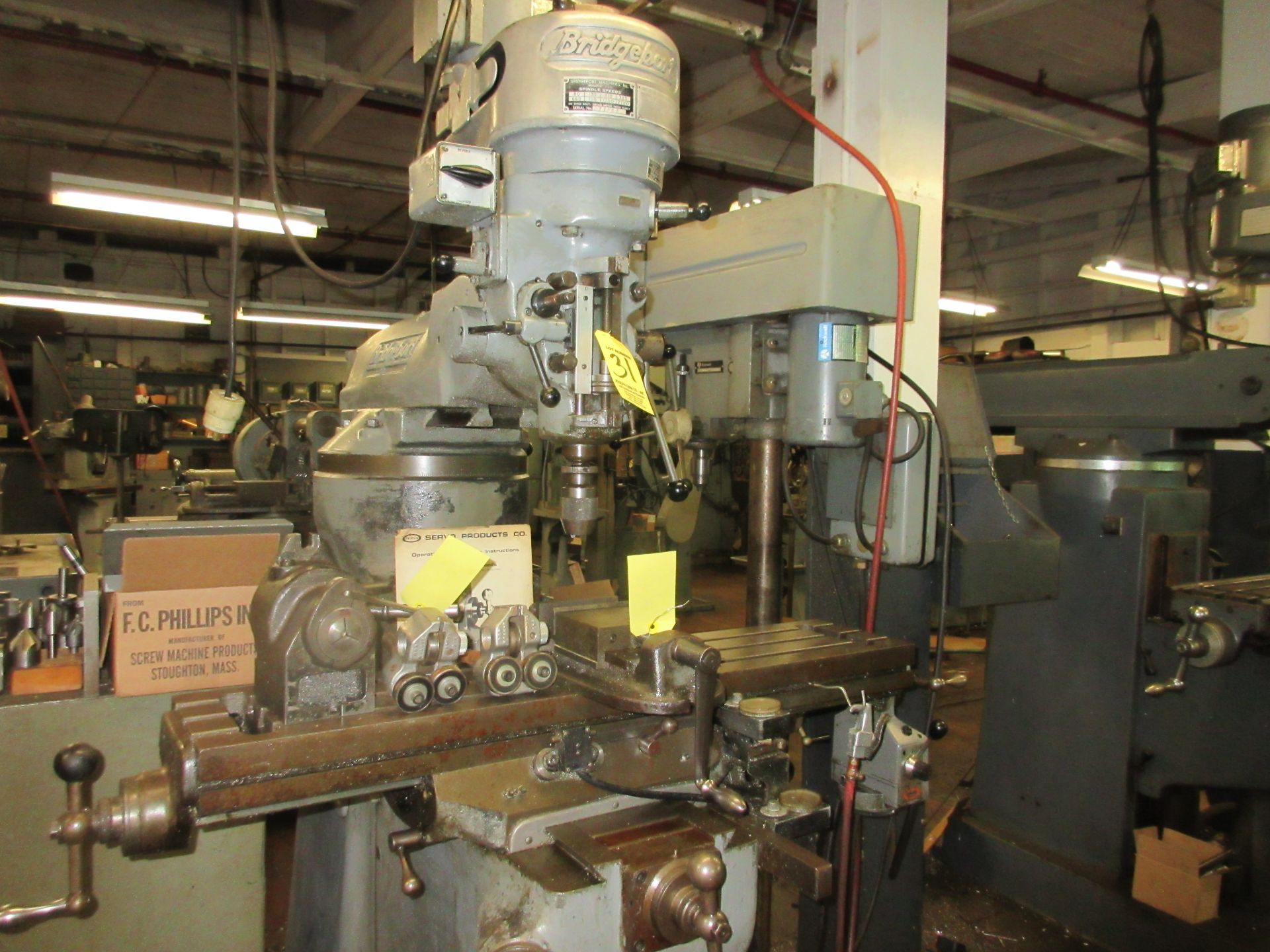 (1) Bridgeport Vert. Mill, S/N 83244, 42" P.F. Table