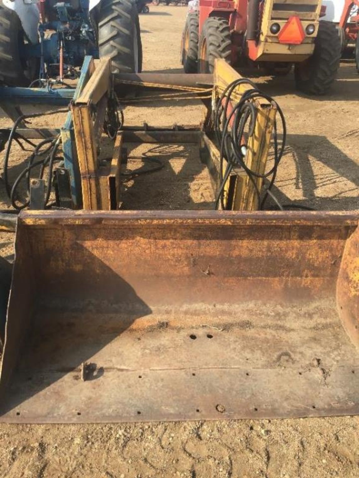 Ezee-On Front End Loader Fits on the 5000 Ford Tractor. Mounting brackets are on the Tractor.