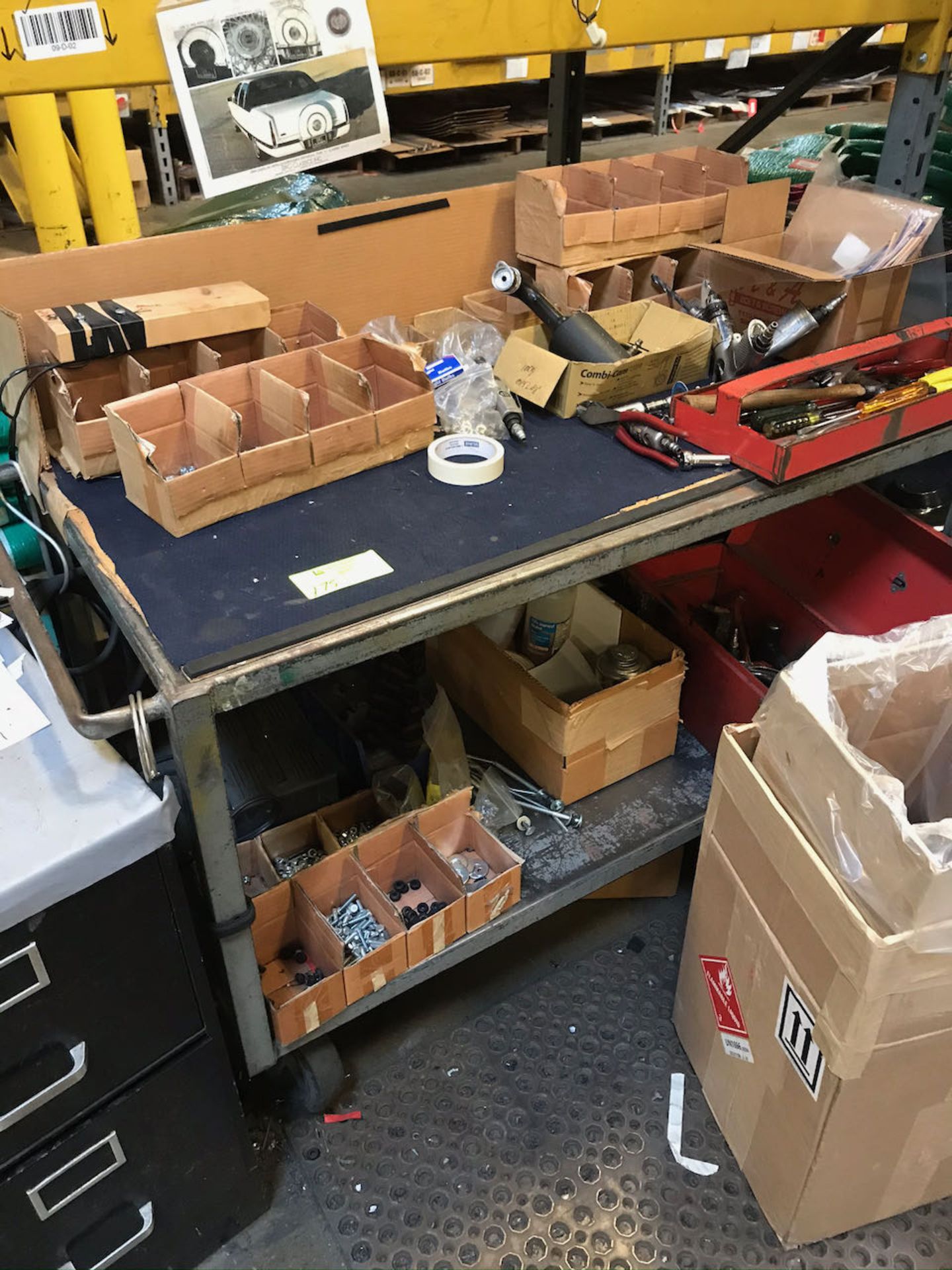 Work table with air tools and file cabinet