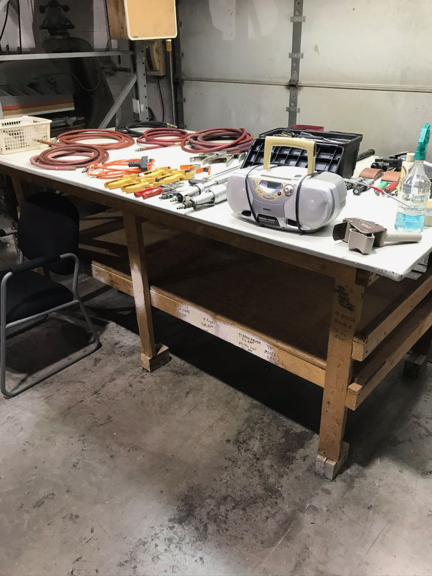 Work table with hoses, tools and clamps