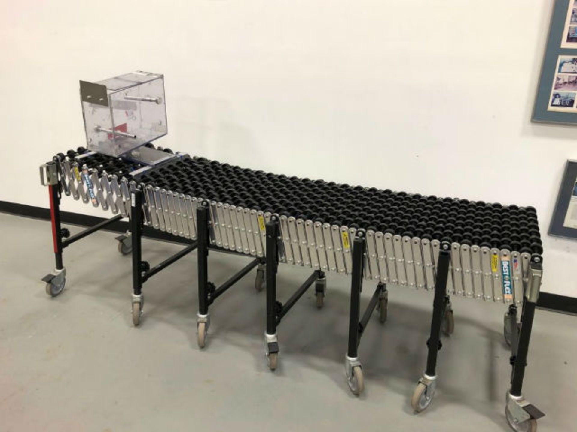 Best Flex Skate Conveyor. Unit measures 24' long when extended, 78" compressed. Height can be