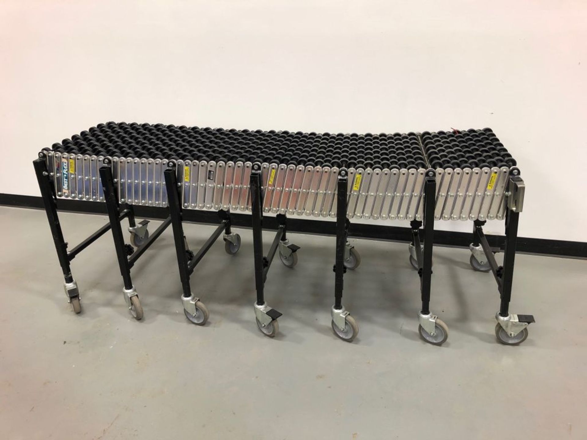 Best Flex Skate Conveyor. Unit measures 24' long when extended, 78" compressed. Height can be - Image 2 of 4