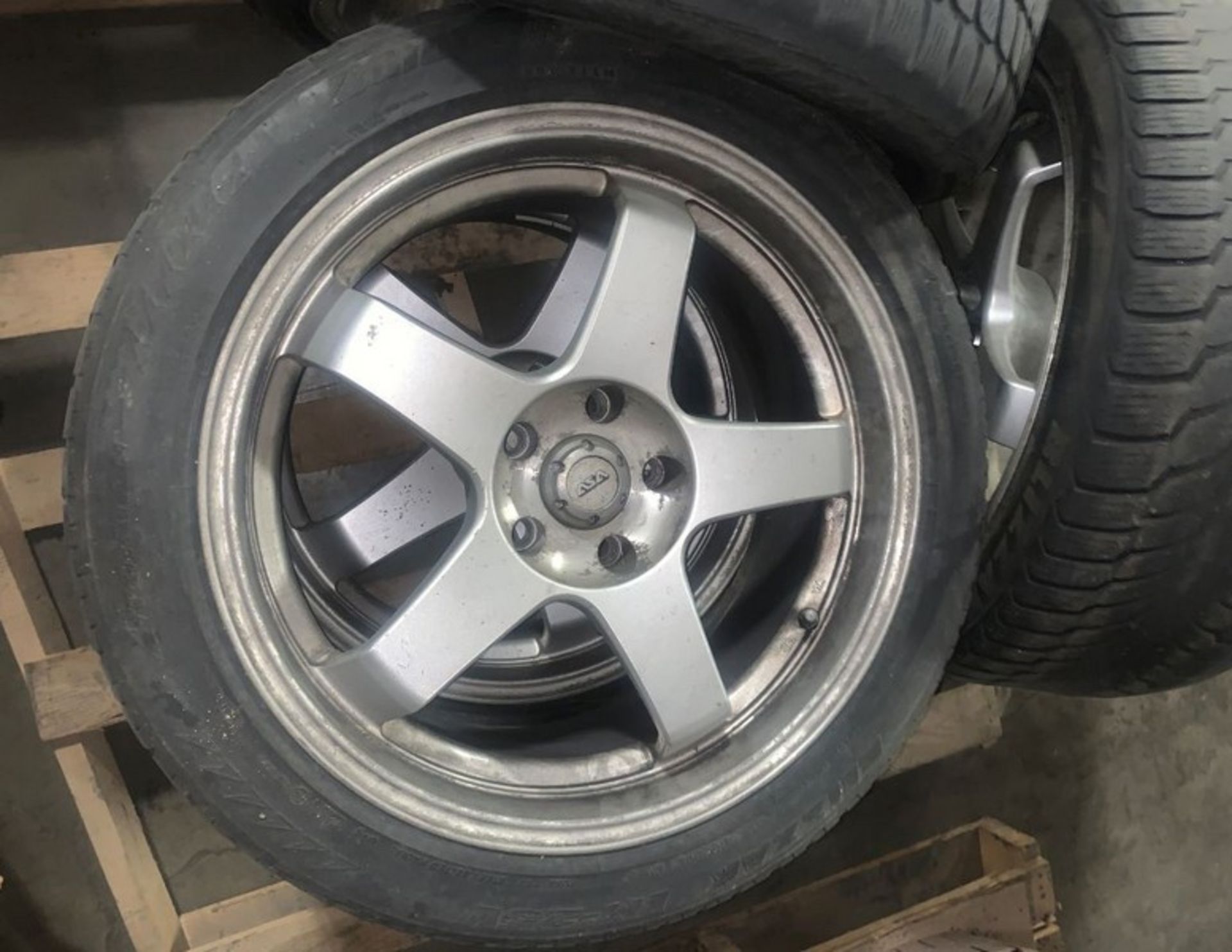 Set of four BLIZZAK tires on rim. Were used on a BMW 750Li (LOCATED IN IOWA, RIGGING INCLUDED WITH - Image 2 of 4