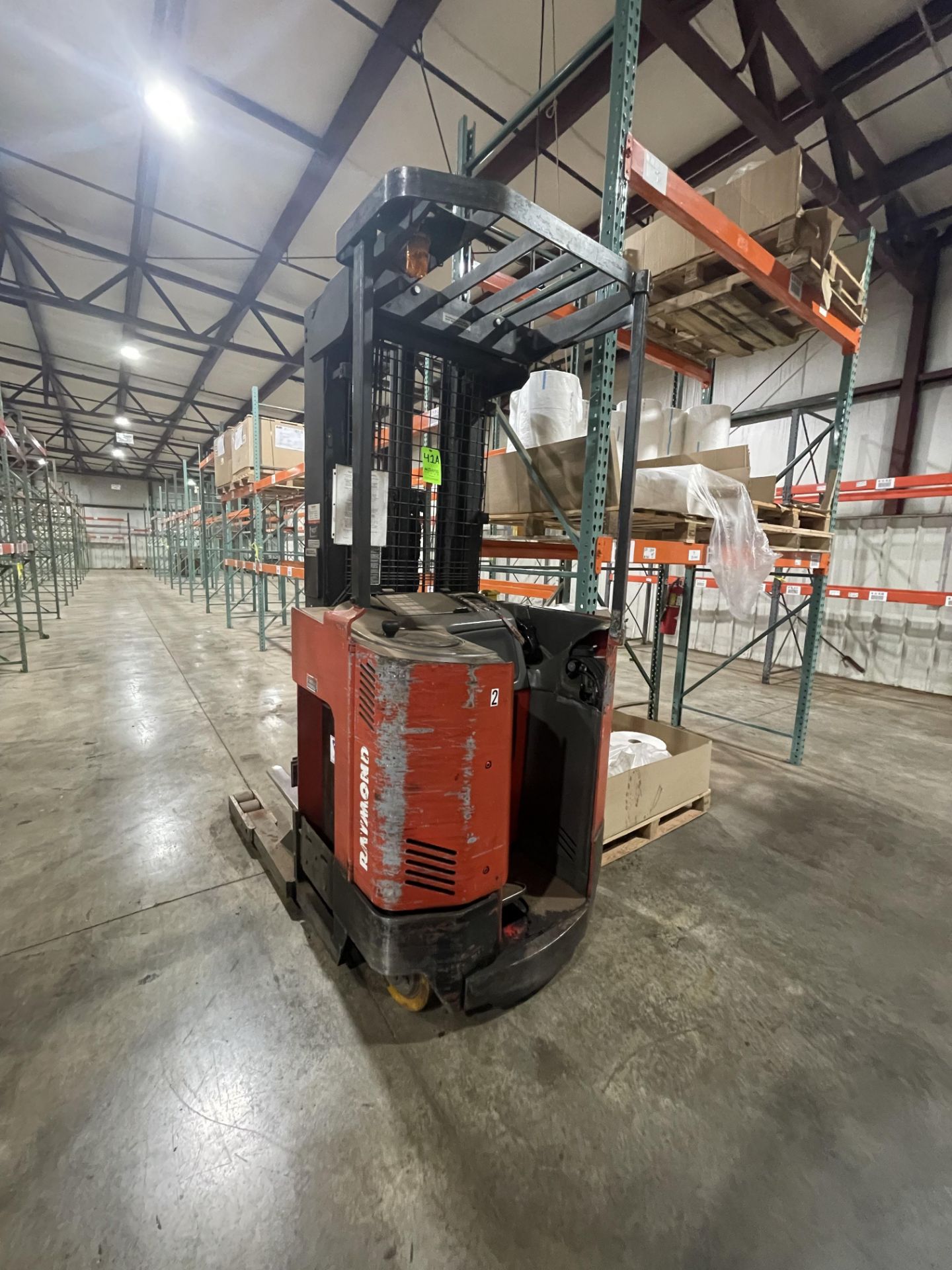 RAYMOND 4,000 LB STANDUP FORKLIFT, MODEL EASI, S/N ET-B-97-04446, APPROX. 42" LONG FORKS, BBI 24