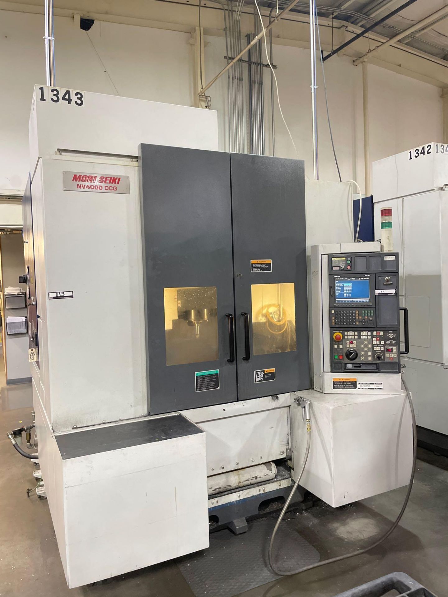 Mori Seiki NV-4000DCG, MSX-501 ctrl, 23" x 15" x 15" trvls, 12K RPM, CT40, 40 ATC, New 2004