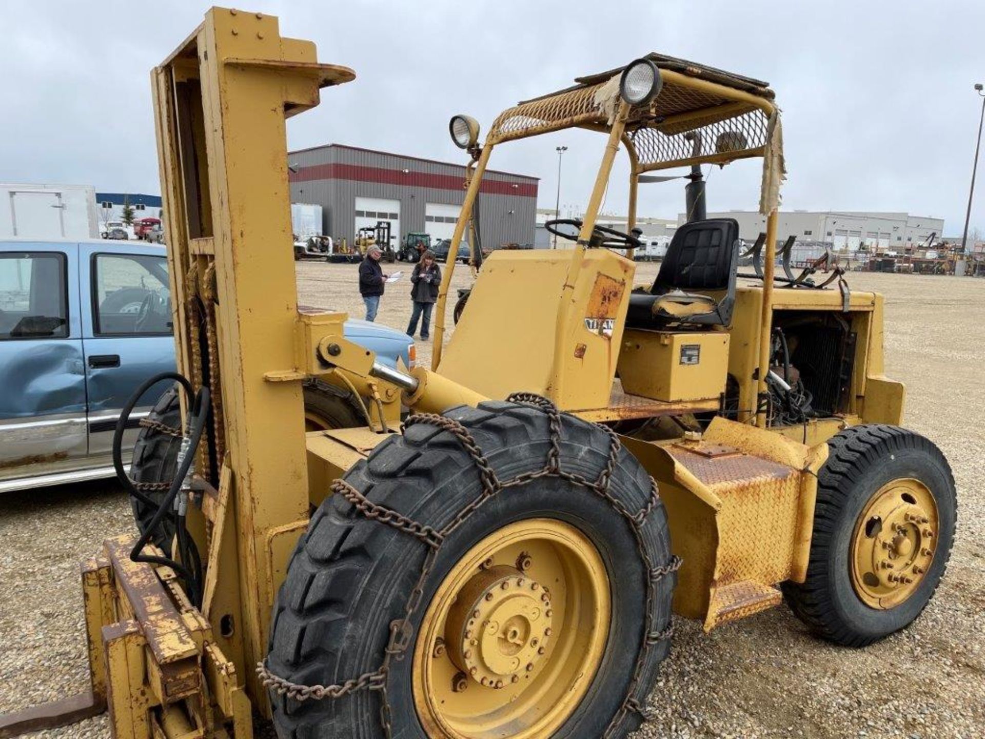 CARE EQUIPMENT 5000LB FORKLIFT S/N 379-T50-51, 13X24R & 9.00-20 RUBBER W/CANOPY, TIRE CHAINS, FORD