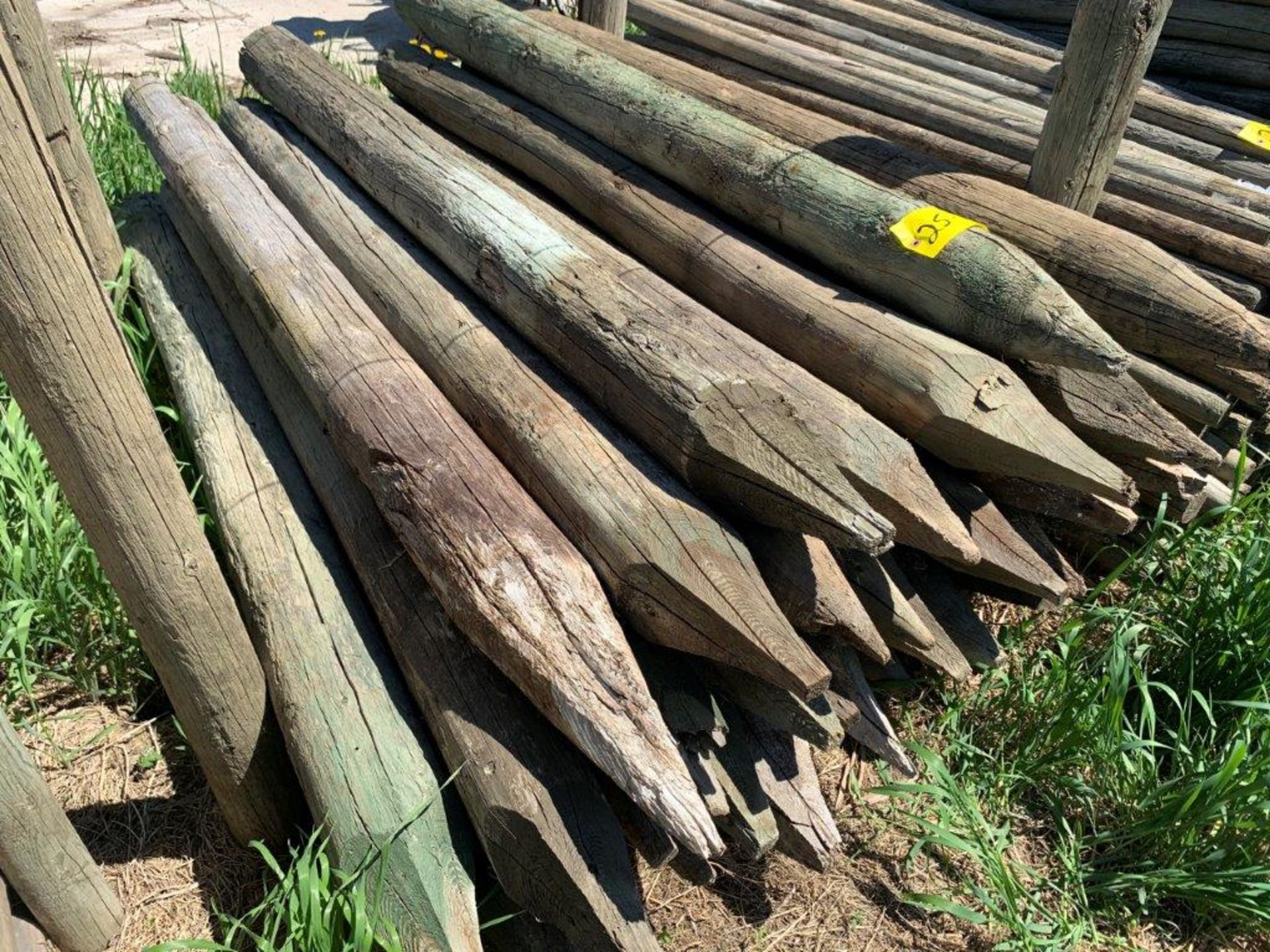 25-17 L/O 5"X6 FT TREATED FENCE POSTS - LOCATED AT VAN STRYLAND FARMS CLIVE CALL CRAIG TO VIEW 403-