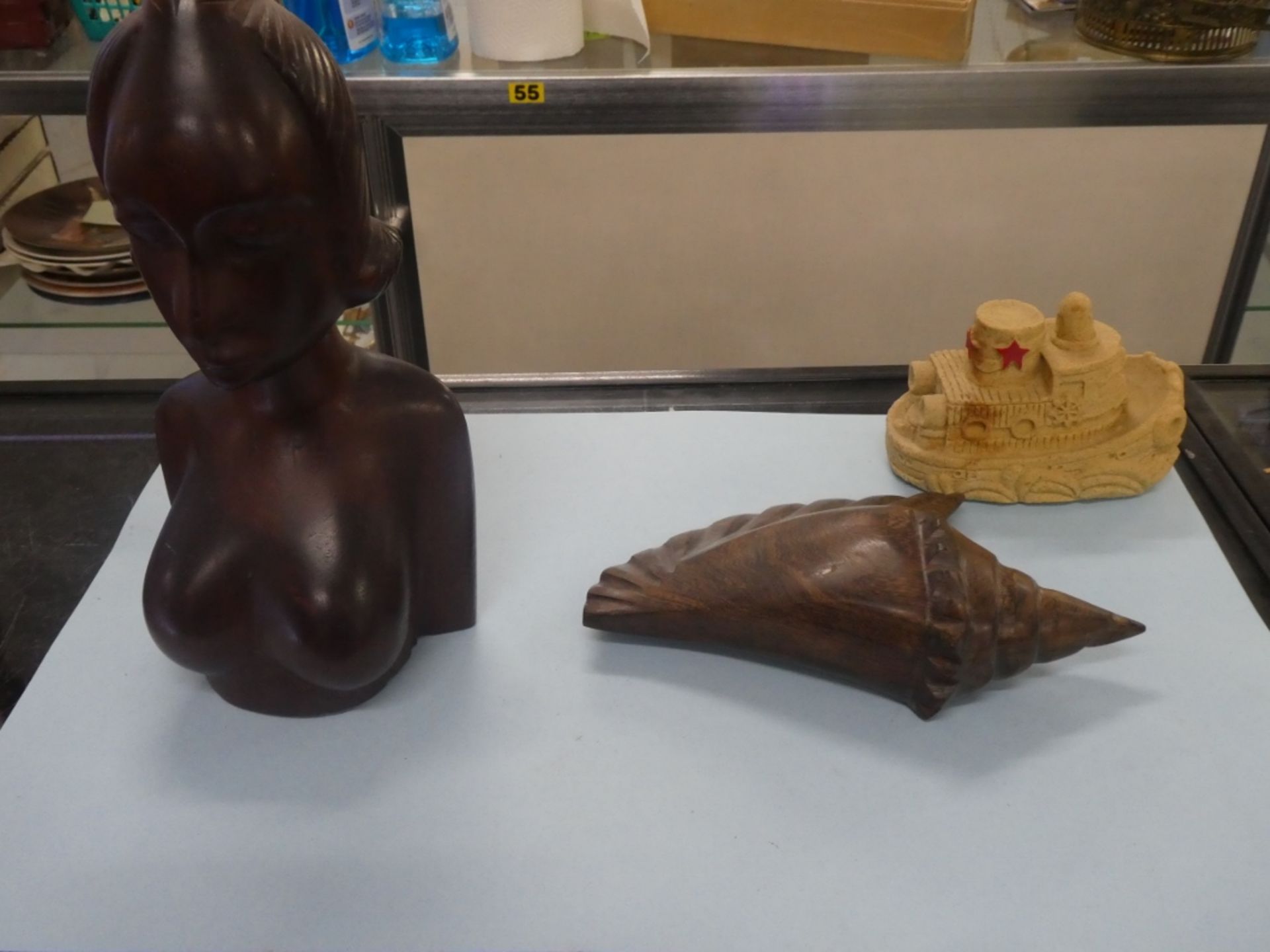 1 IRONWOOD CARVED BUST, 1 IRONWOOD CARVED SHELL, 1 SAND CAST TUGBOAT