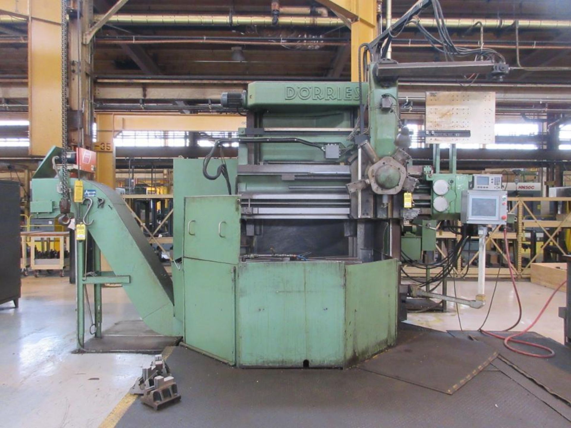 D'ORRIES 63 IN. VERTICAL TURNING LATHE, 5-STATION TURRET, ACU-RITE D.R.O., OUTFEED CHIP CONVEYOR,