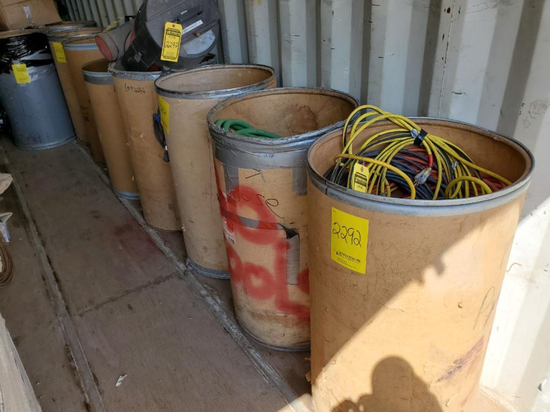 ALL BARRELS ON LEFT SIDE OF CONEX BOX, WELDING HOSES, EXTENSION CORDS, LINCOLN ELECTRIC FUME EXTRACT