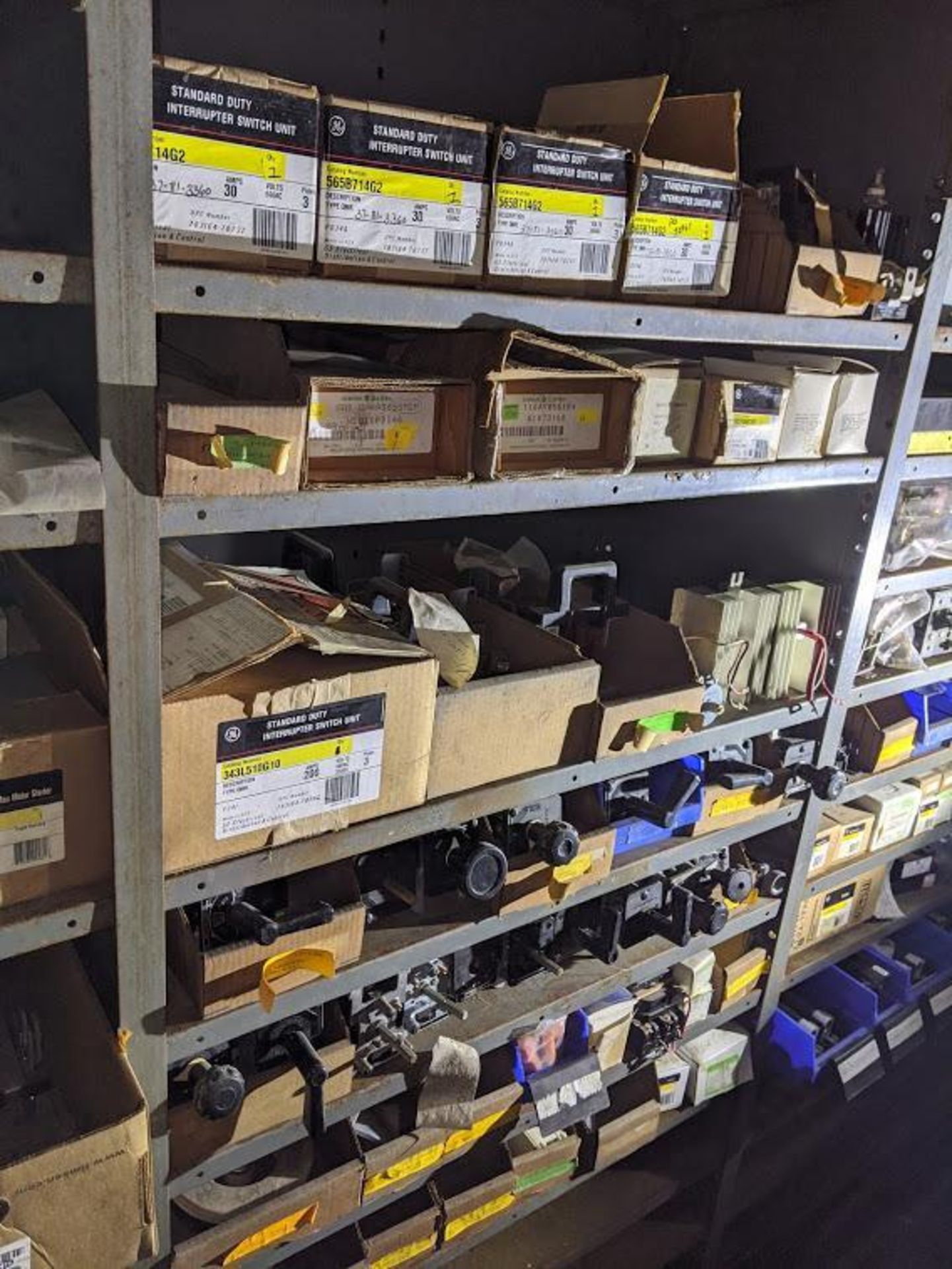 7 SHELVES OF GE SWITCHES AND OTHER CONTROL PARTS