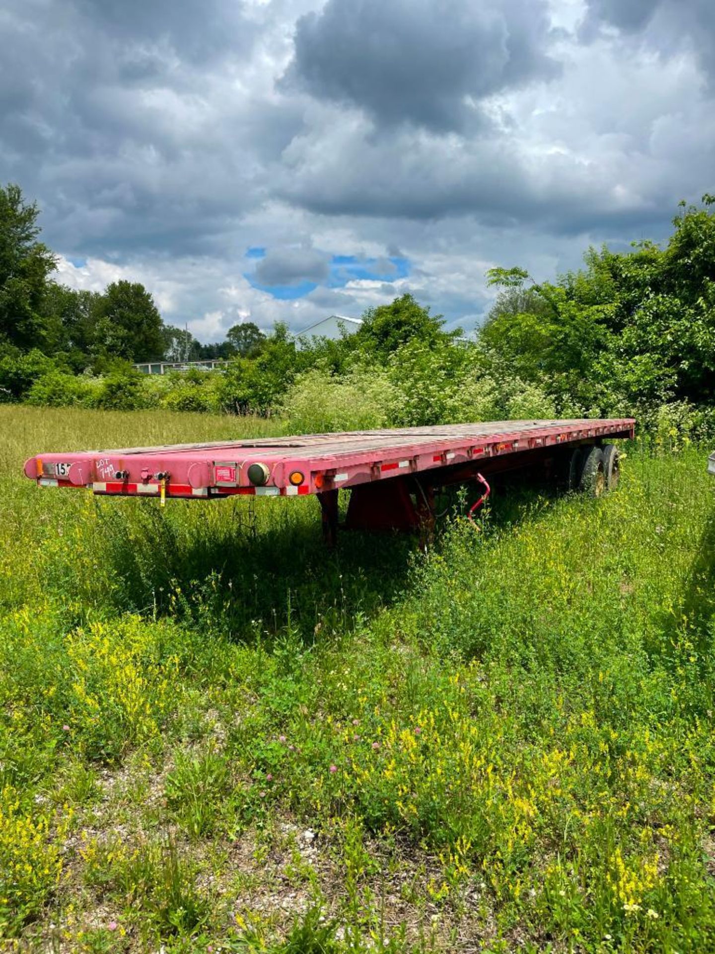 1983 FRUEHAUF EXTENDABLE STEEL FLATBED TRAILER, WOOD DECK DUAL TANDEM AXLE, 40'-65' STRETCH,