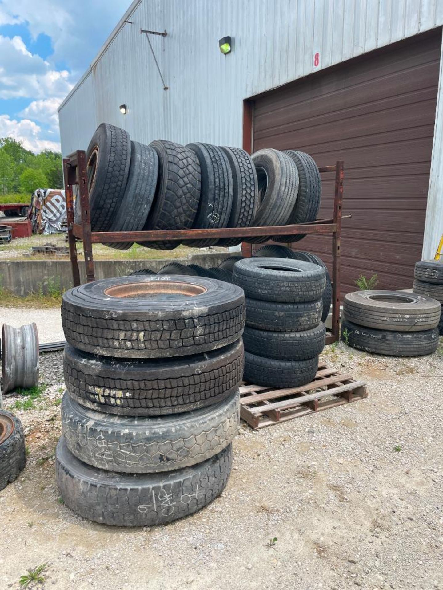 (3) TIRE RACKS AND ASSORTED NEW AND USED TIRES - Image 5 of 6