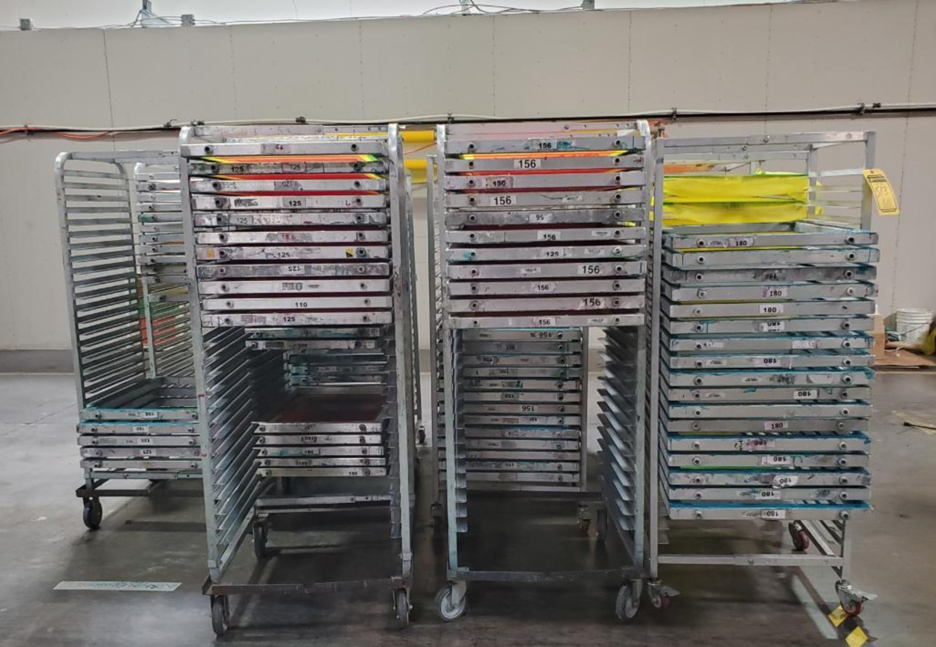 (11) METAL SCREEN RACKS WITH (125+/-) SCREEN FRAMES