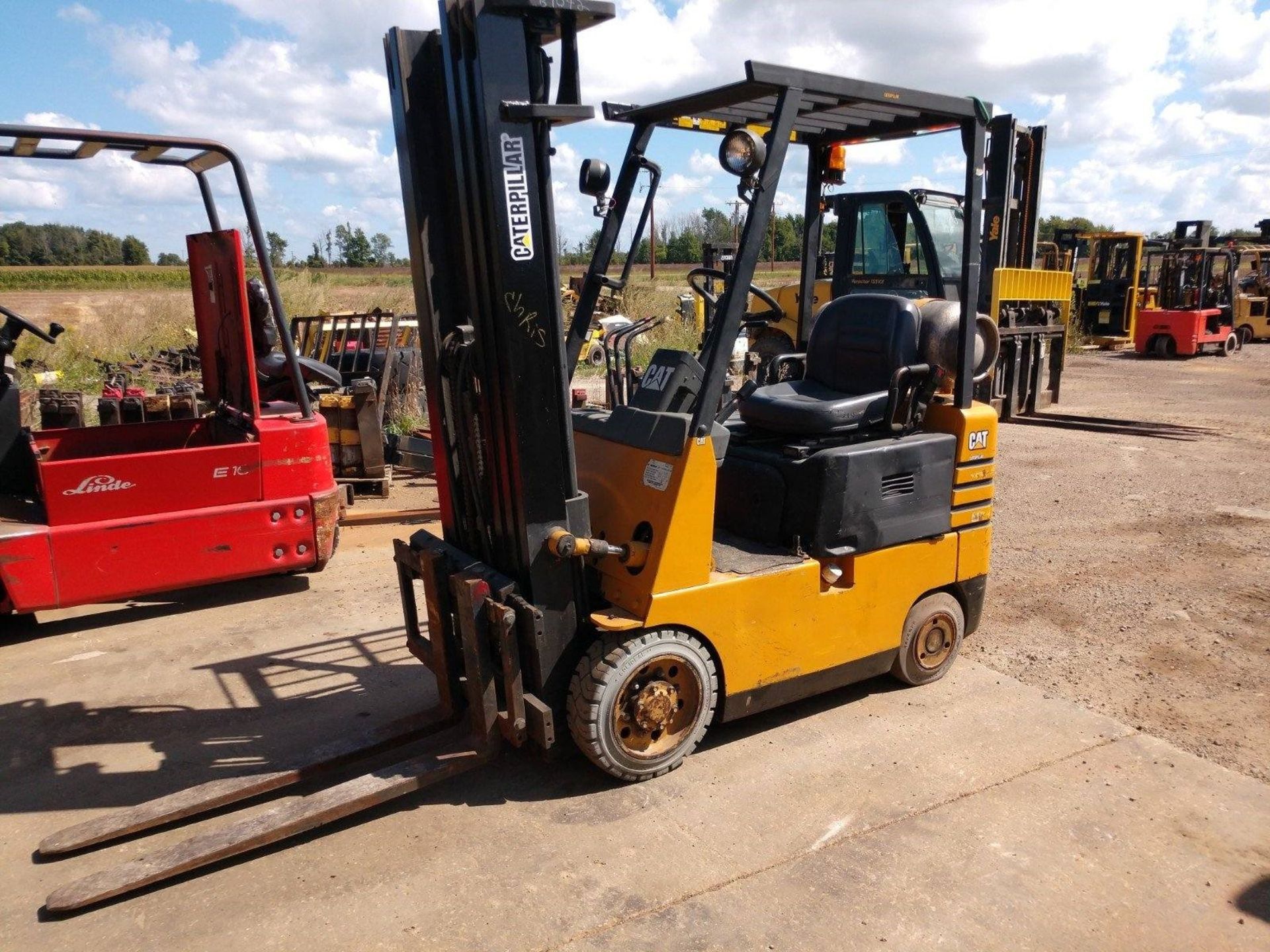 CATERPILLAR 3,000-LB. CAPACITY FORKLIFT, MODEL: GC15, S/N: 2EM01694, LPG, SOLID TIRES, 3-STAGE MAST,