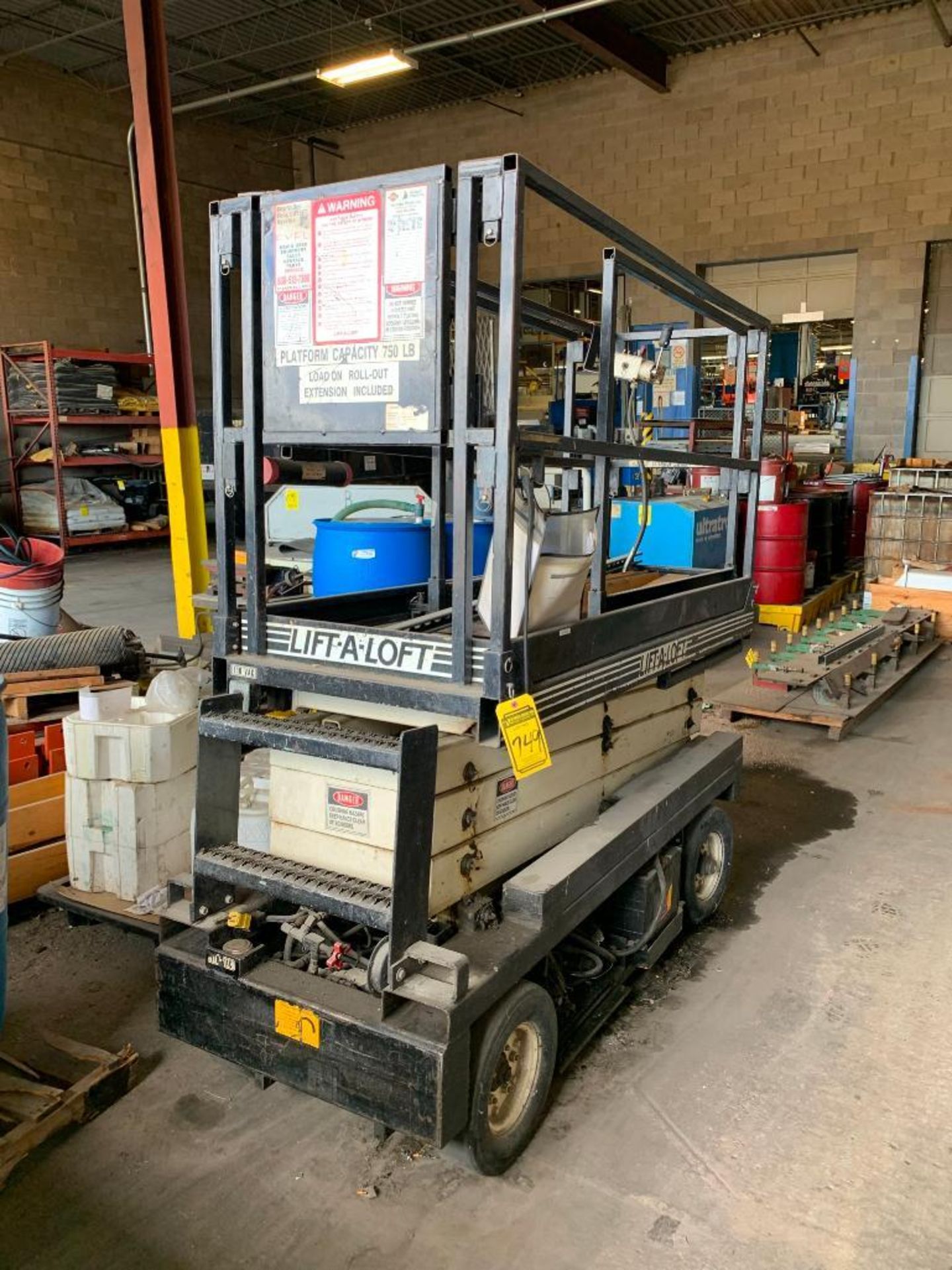 1987 LIFT-A-LOT 20' ELECTRIC SCISSOR LIFT, MODEL SP20, EXTENDED PLATFORM, 24 V, SOLID SMOOTH TIRES,