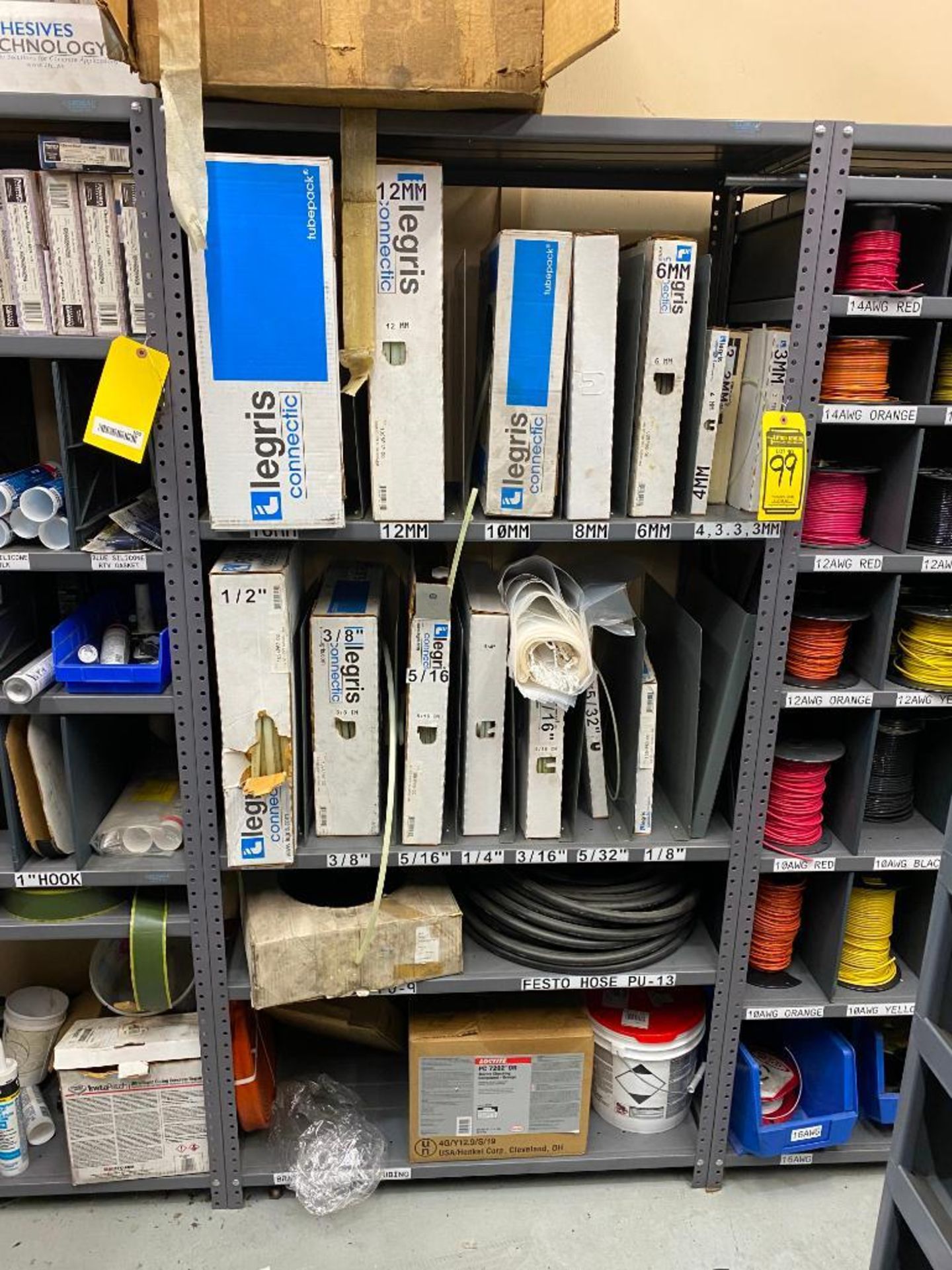 SHELF AND CONTENTS OF ASSORTED HYDRAULIC HOSE, AND PLASTIC TUBING